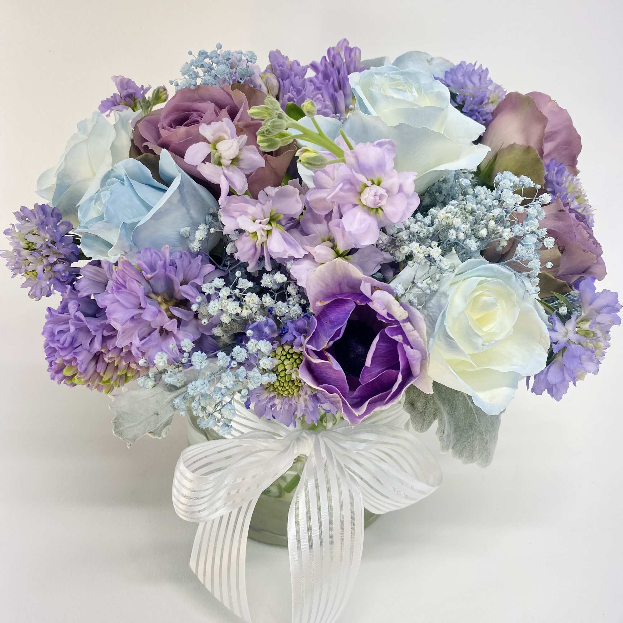 Soft, dreamy flower arrangement with vintage look roses will make your loved