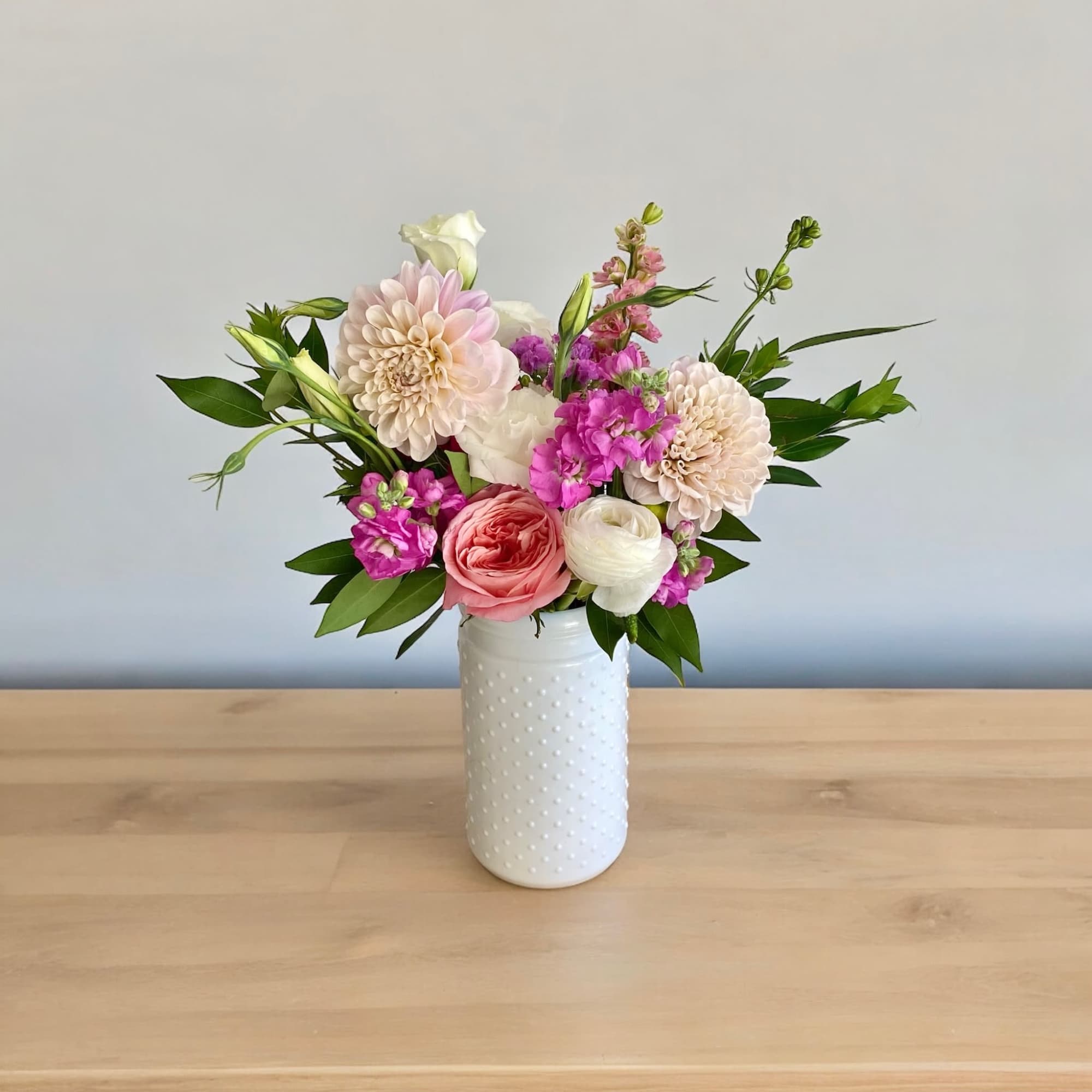 Petite yet full of happiness in a hobnail  or glass vase.