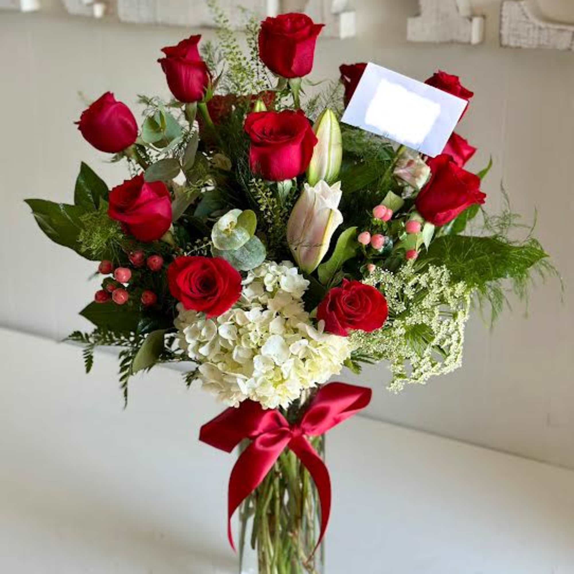 1 dozen long stem vase arrangement with greenery and filler