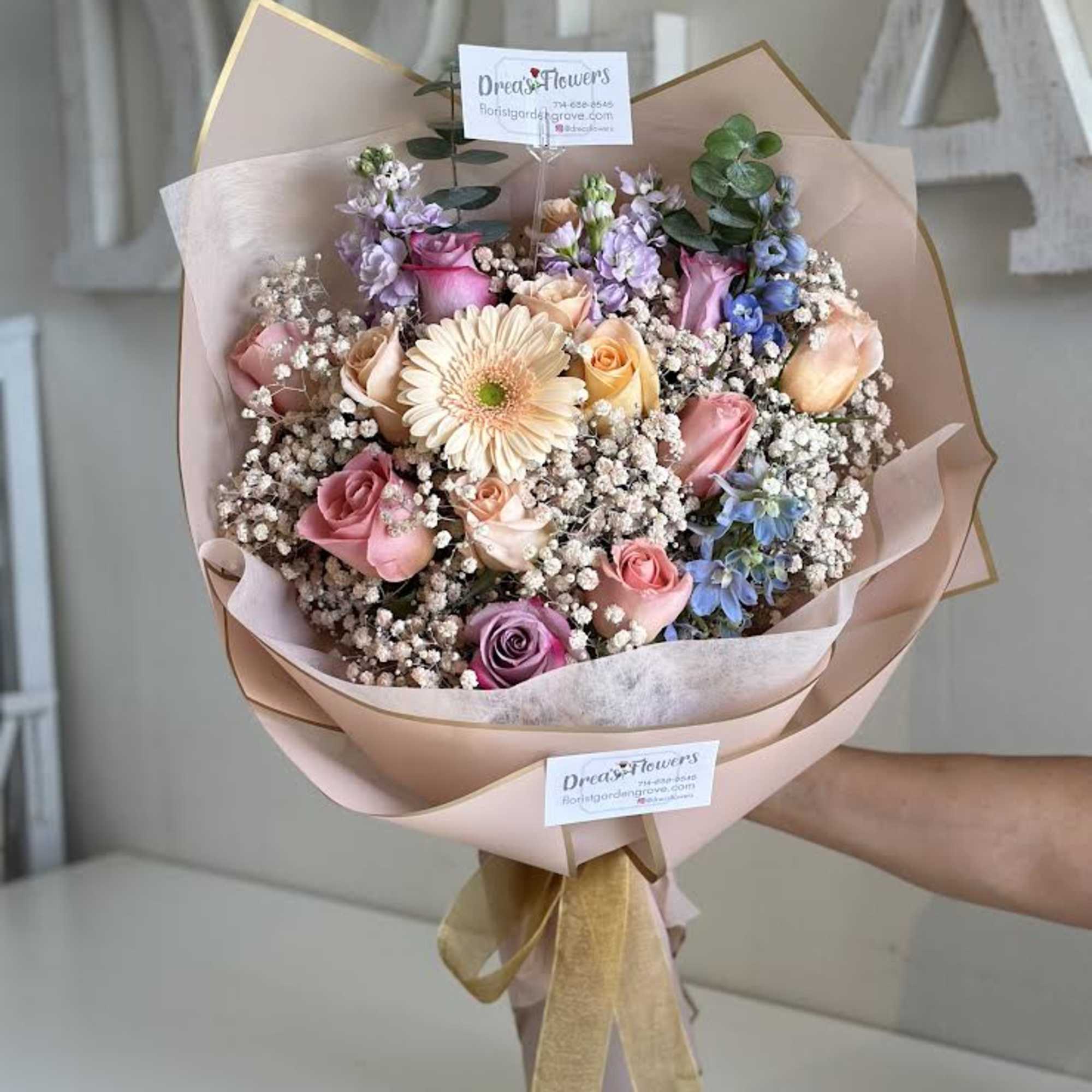 A beautiful handheld bouquet for that special someone whose favorite is pastel