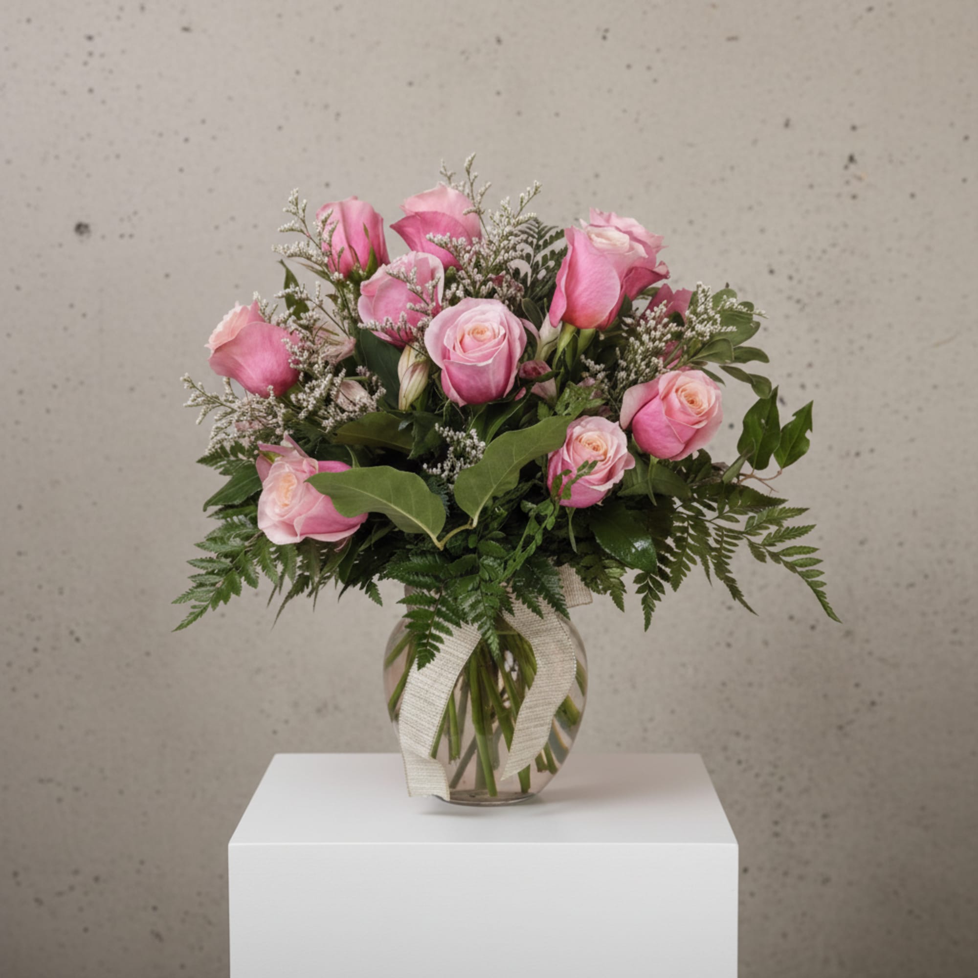 Nothing says romance quite like a dozen pink roses. This classic bouquet