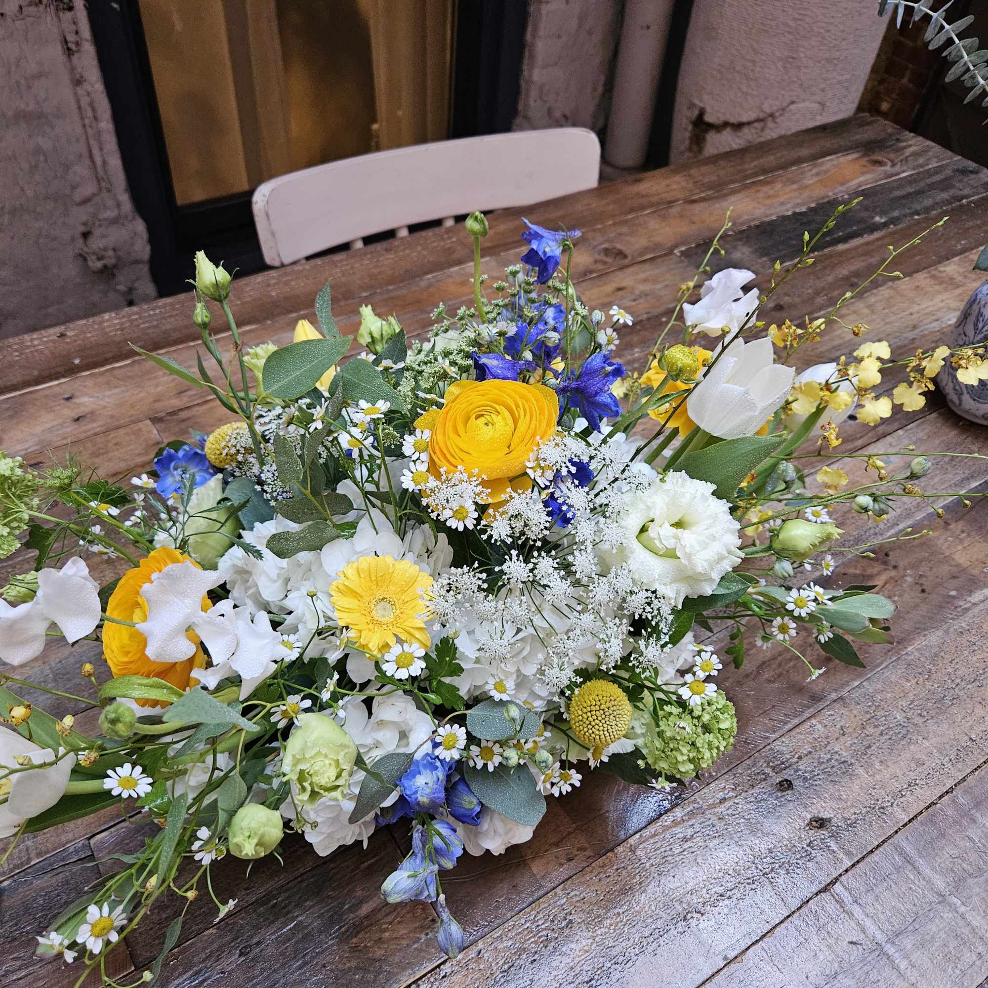 Beautiful centerpiece. Long and Low style which is great for rectangular table.