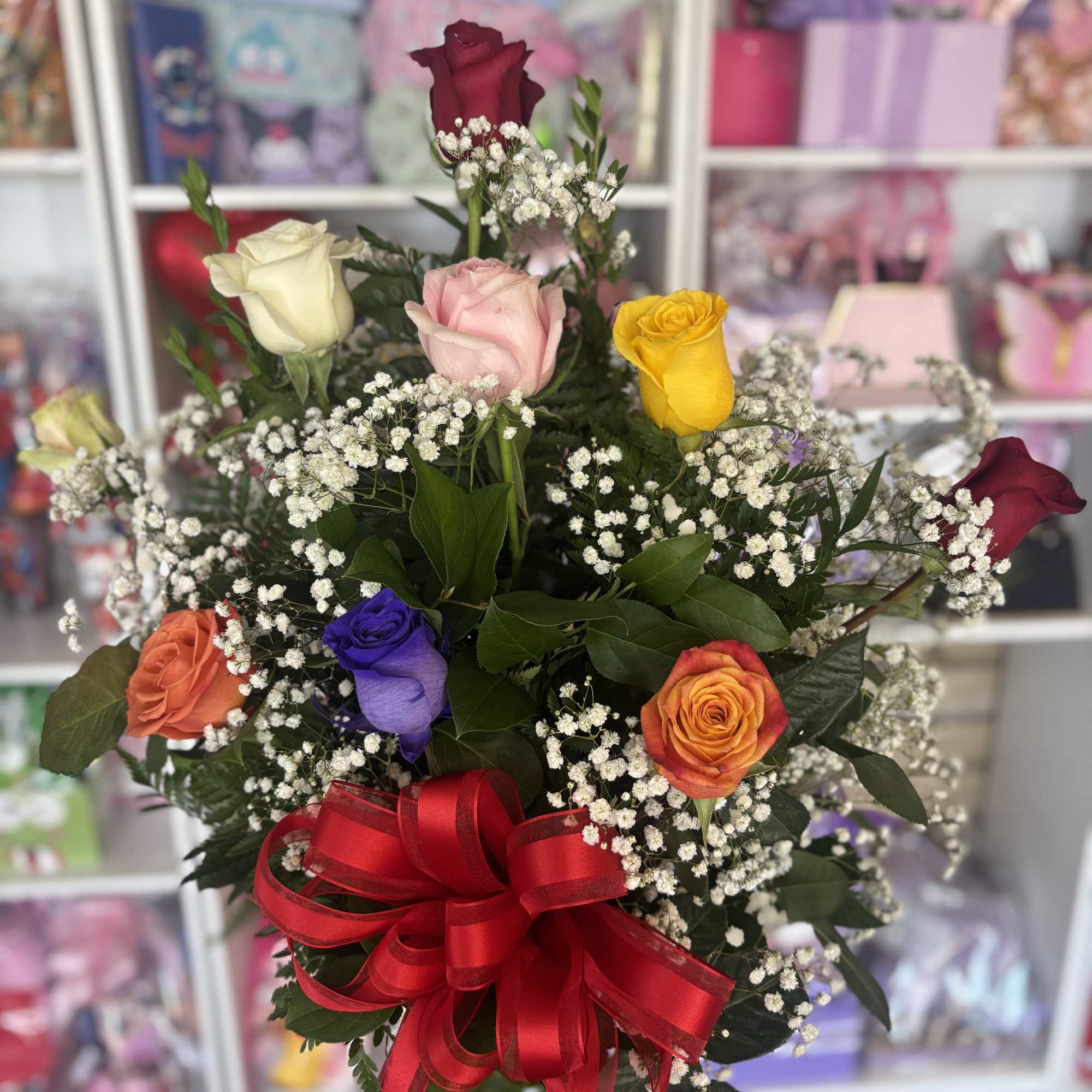 Twelve color Roses  in vase  with greenery and baby breath