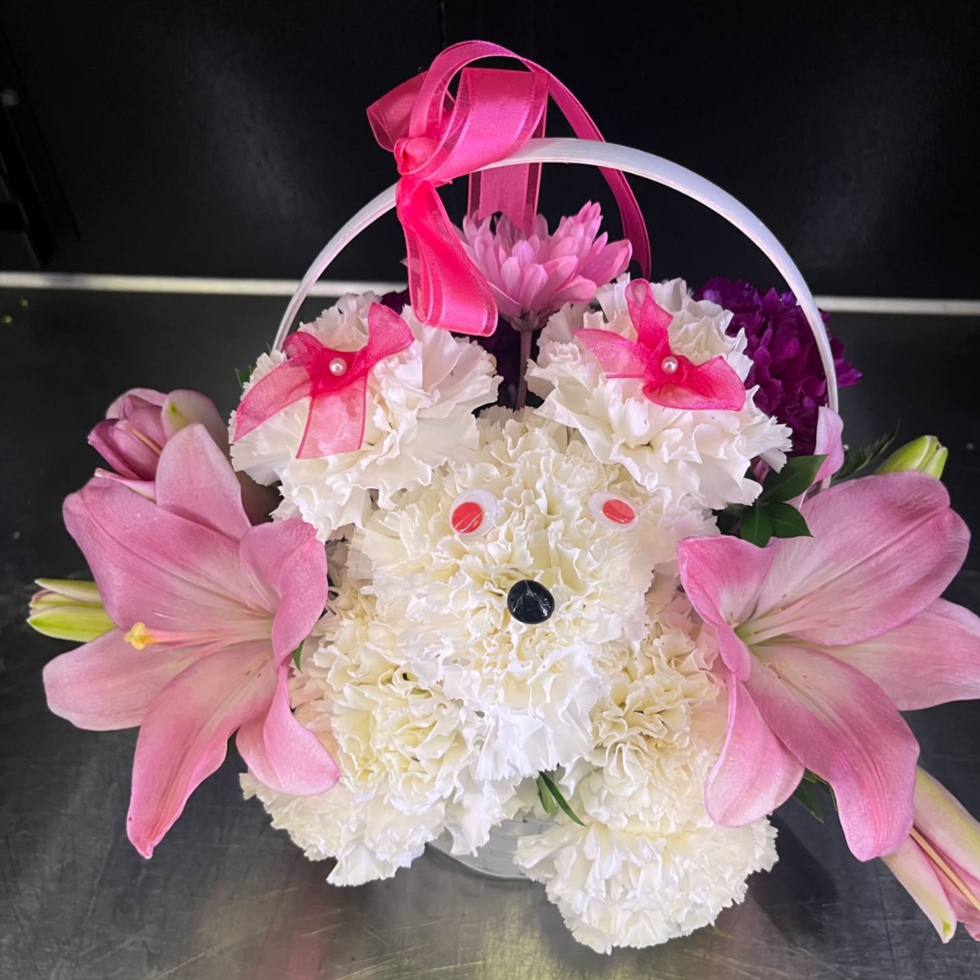 Flower shape dog in basket with flowers 