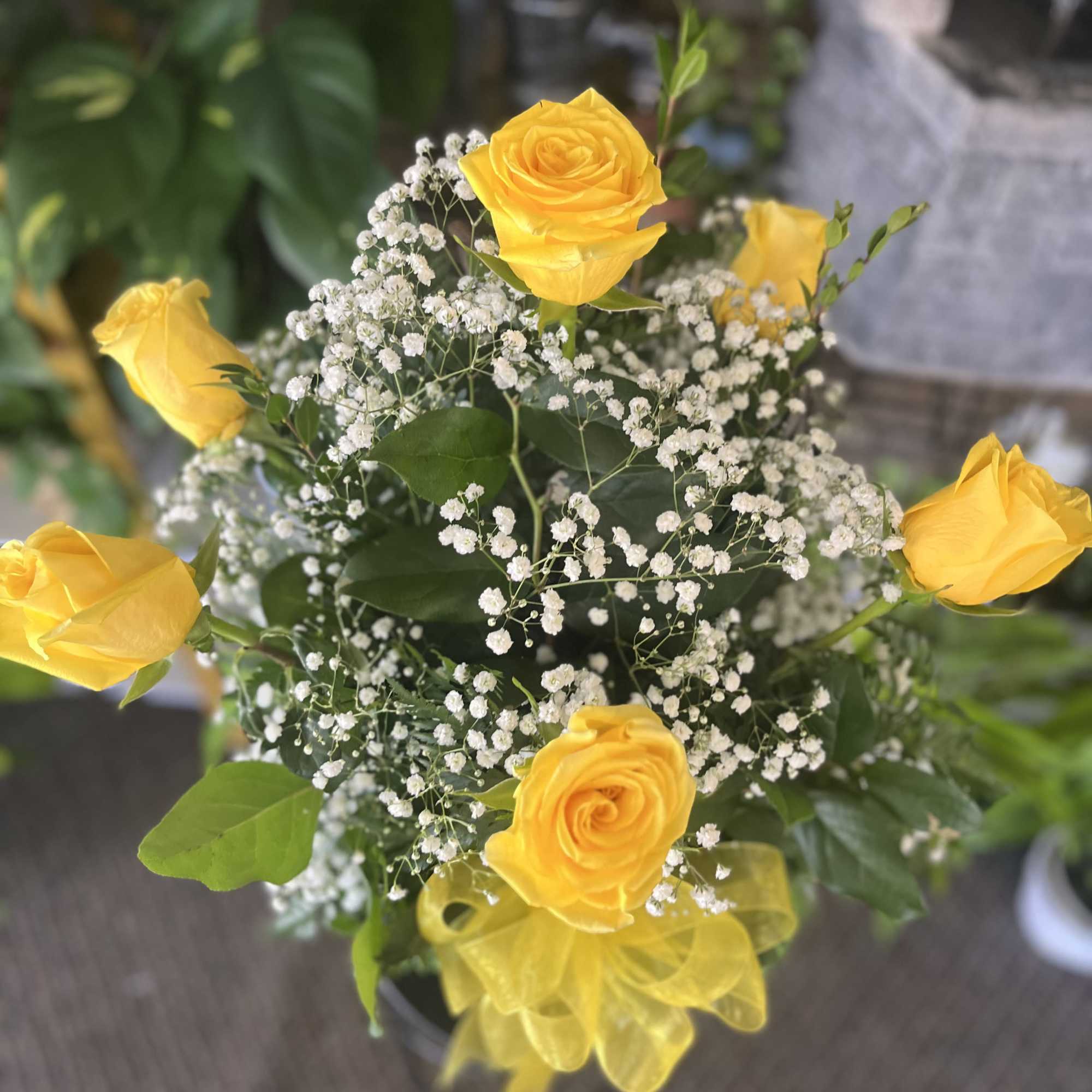 fresh yellow roses with wax ,  and leather 