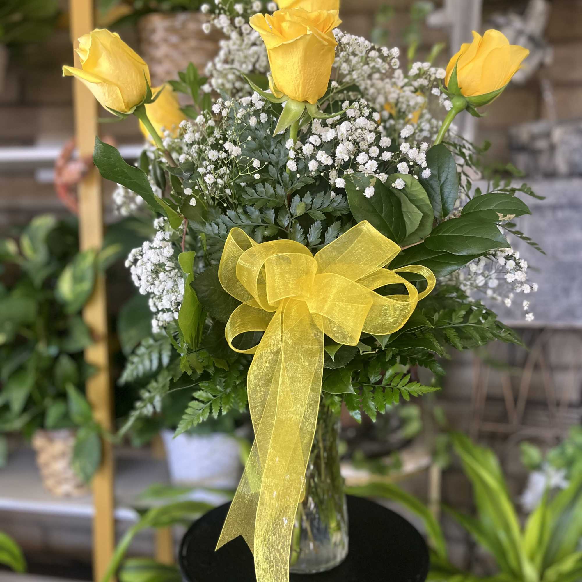 fresh yellow roses with wax ,  and leather 