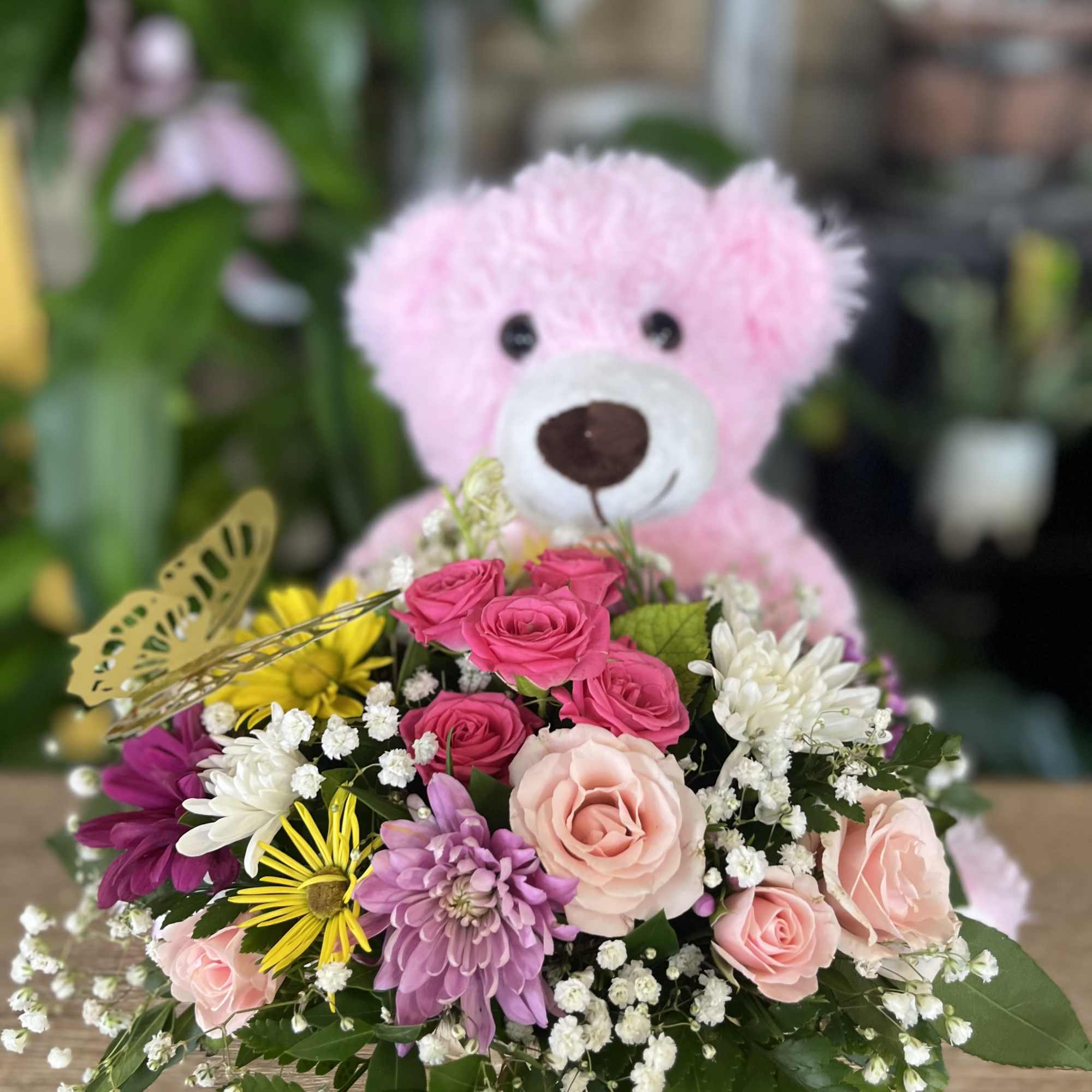 medium size pink plush with basket of fresh flowers 