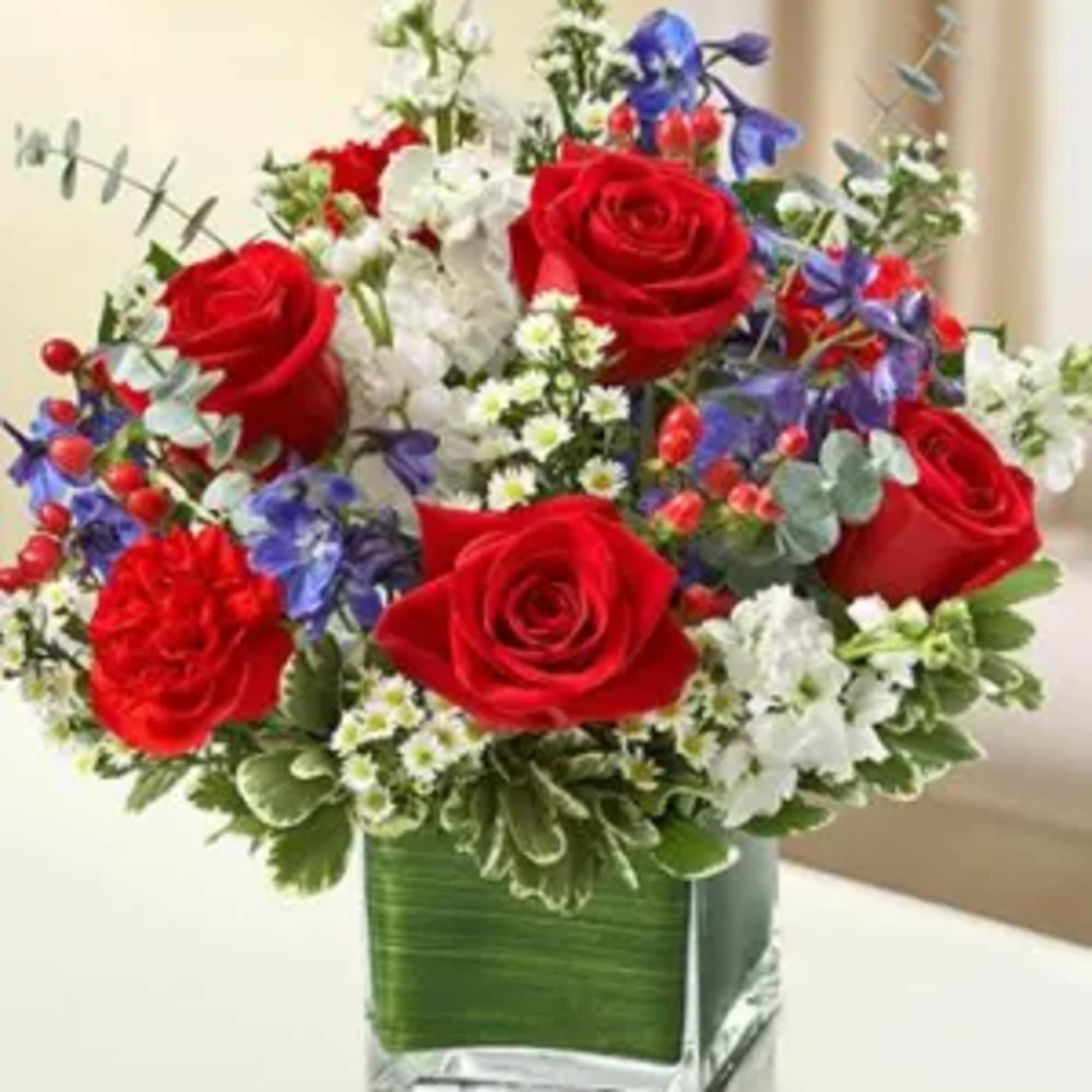 Product ID: 95442

This lovely red, white and blue sympathy arrangement offers a