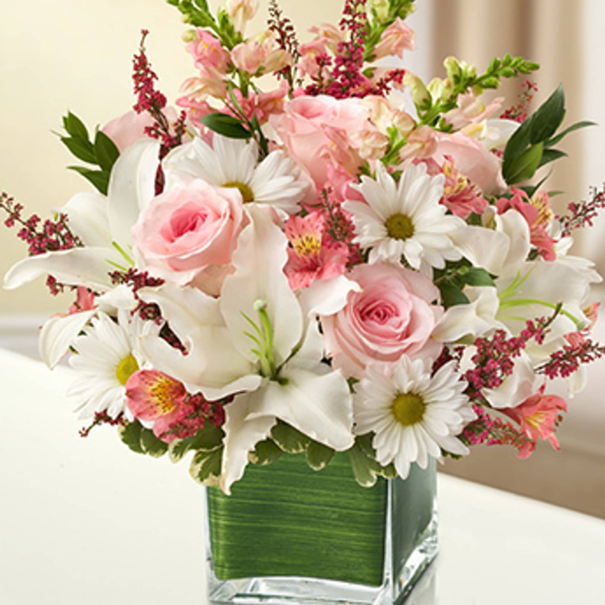 The elegant of our pink and white arrangement conveys your heartfelt condolences