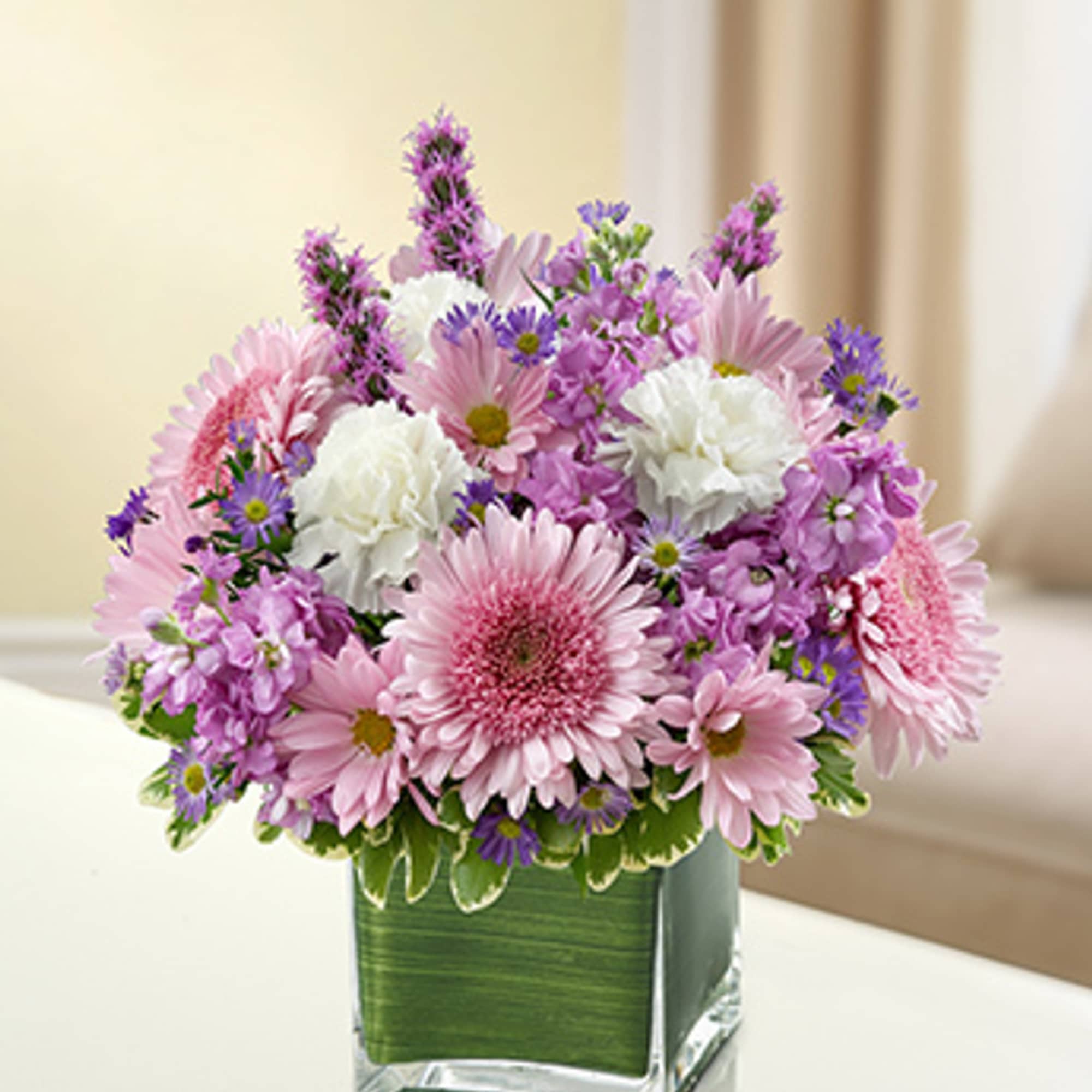 Let the comforting beauty of elegant lavender and white blooms send a