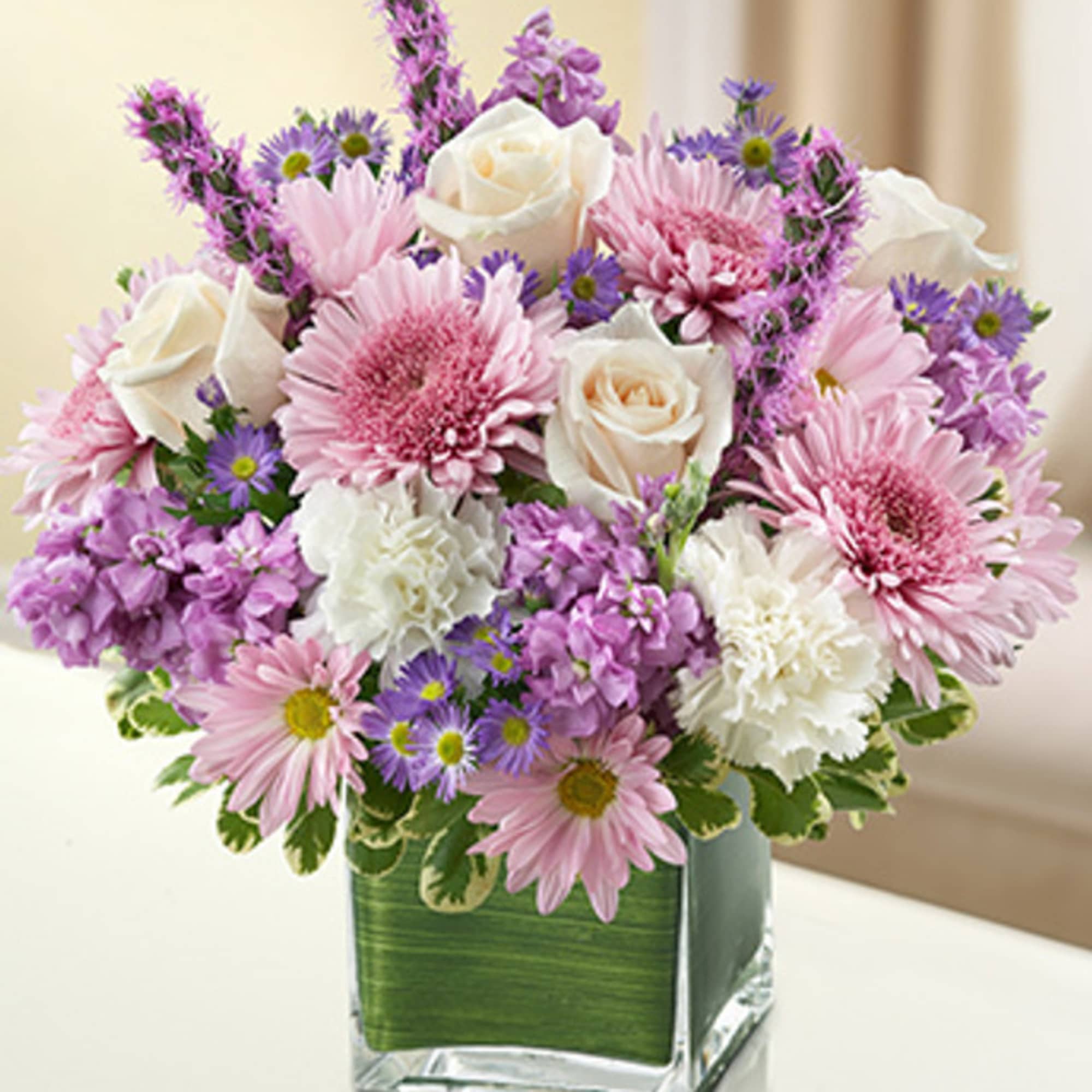 Let the comforting beauty of elegant lavender and white blooms send a