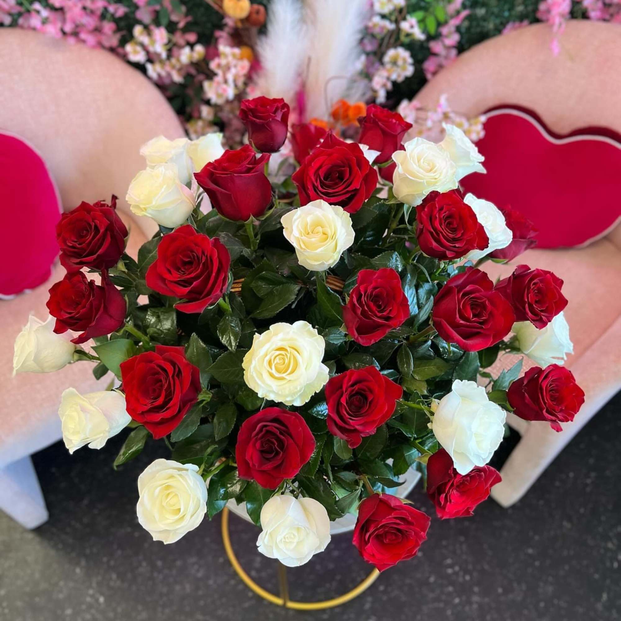 The basket is a timeless arrangement of pristine white and passionate red