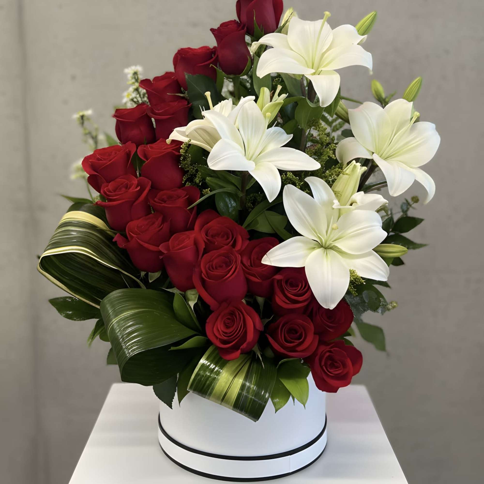 A radiant house arrangement combining the passion of classic red roses with