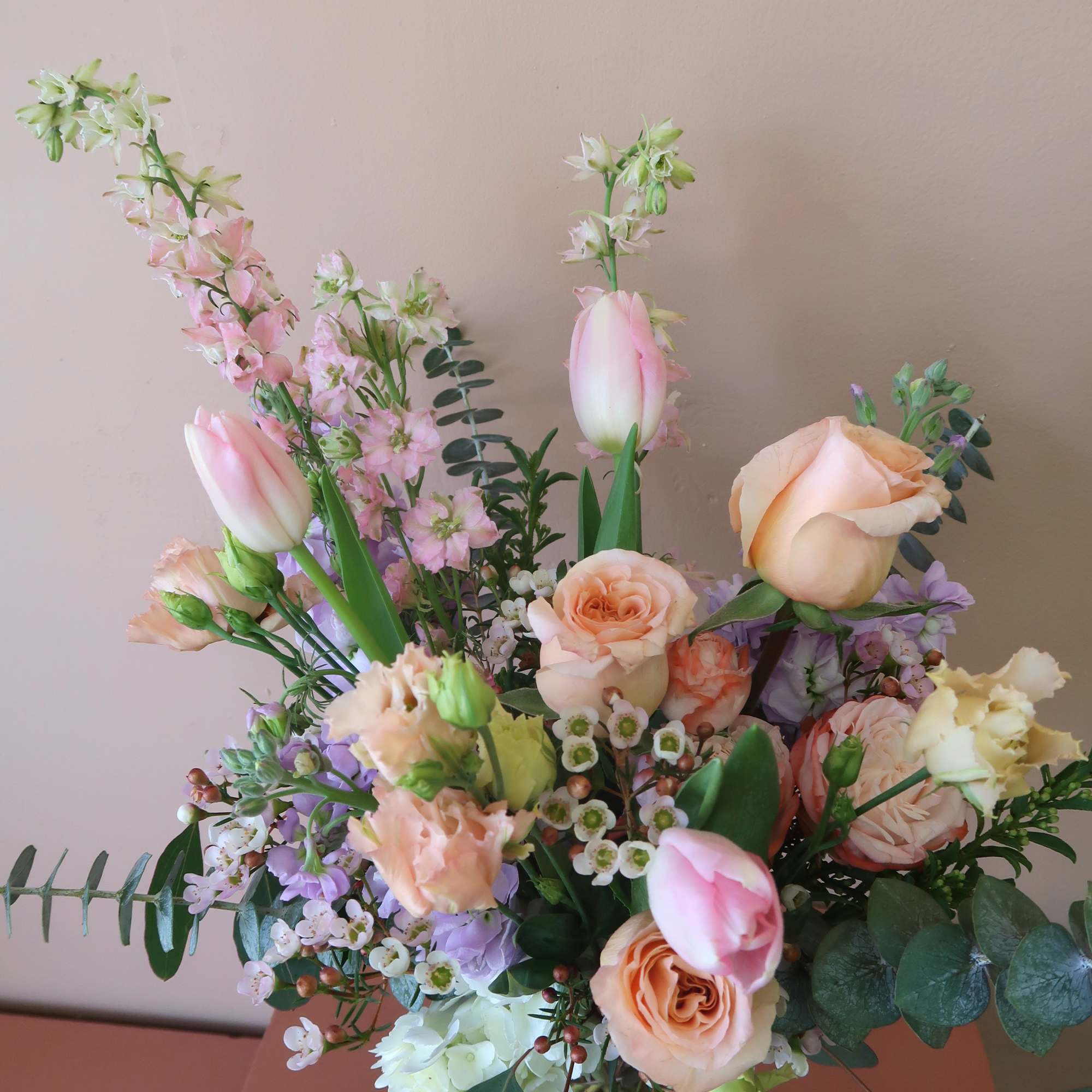 A clear cylinder vase, with all pastel toned flowers for the everyday