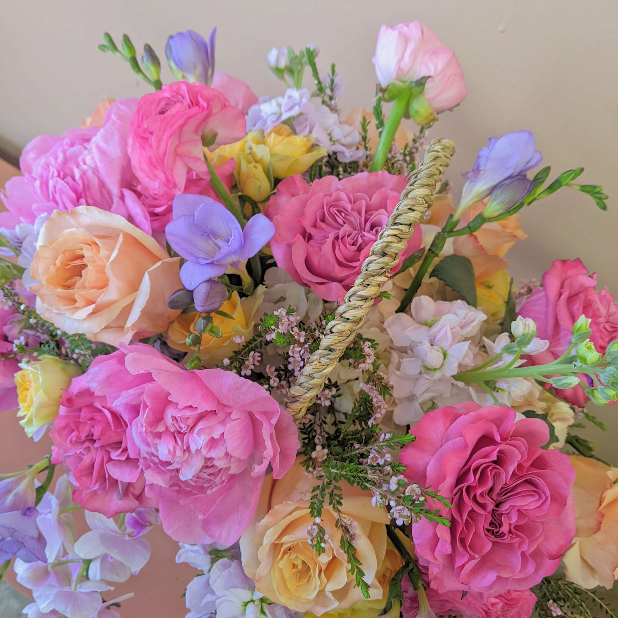 A basket arrangement that is voluminous and full of premium flowers is