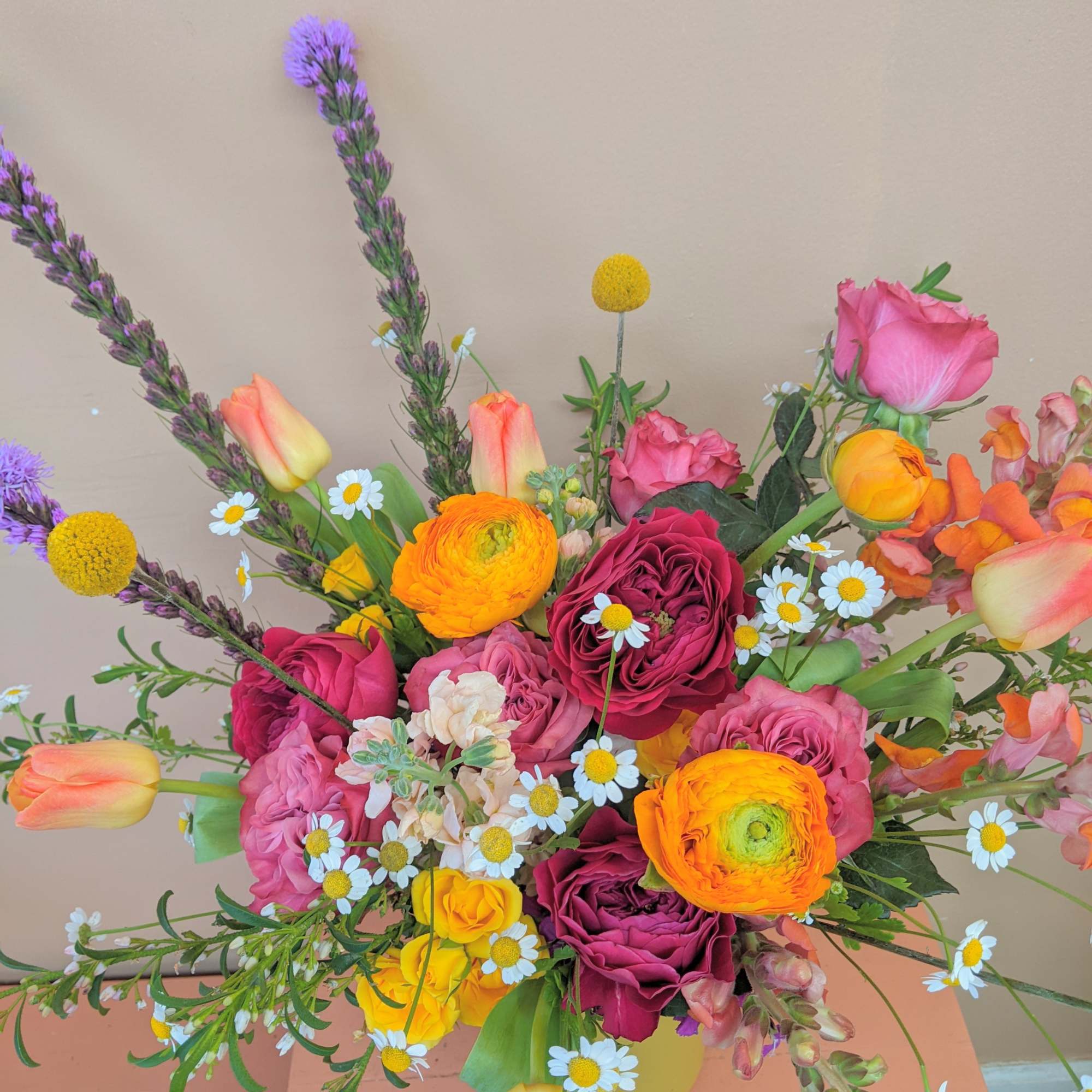 Inspired by the superbloom in California, this vibrant arrangement will wow anyone!