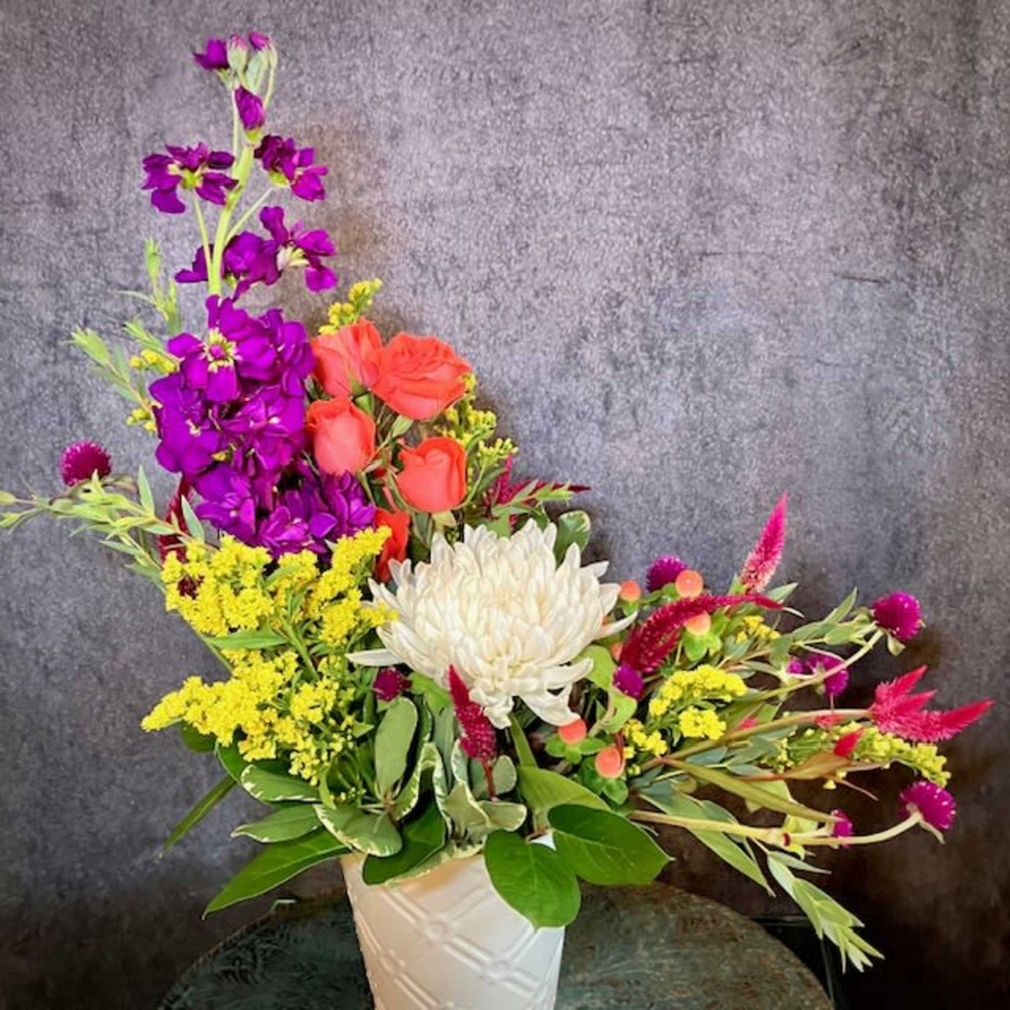 "Brilliant Blossoms" is a beautiful and petite floral design of vibrant flowers