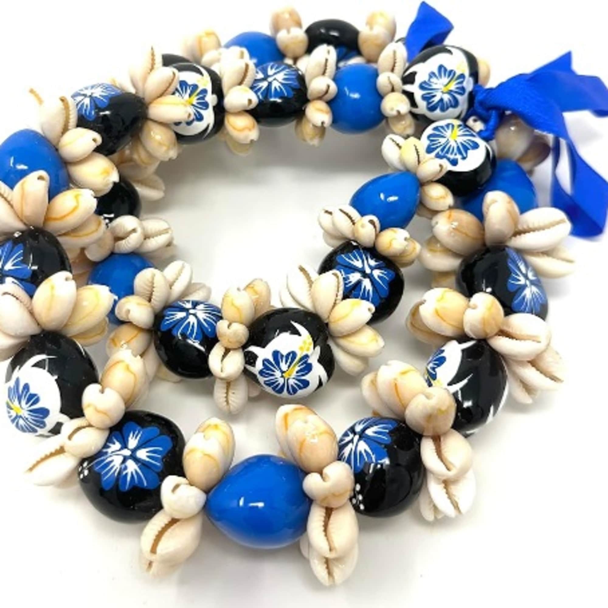 Hawaiian Kukui Nut lei with sea shells on it. **PLEASE SPECIFY COLOR