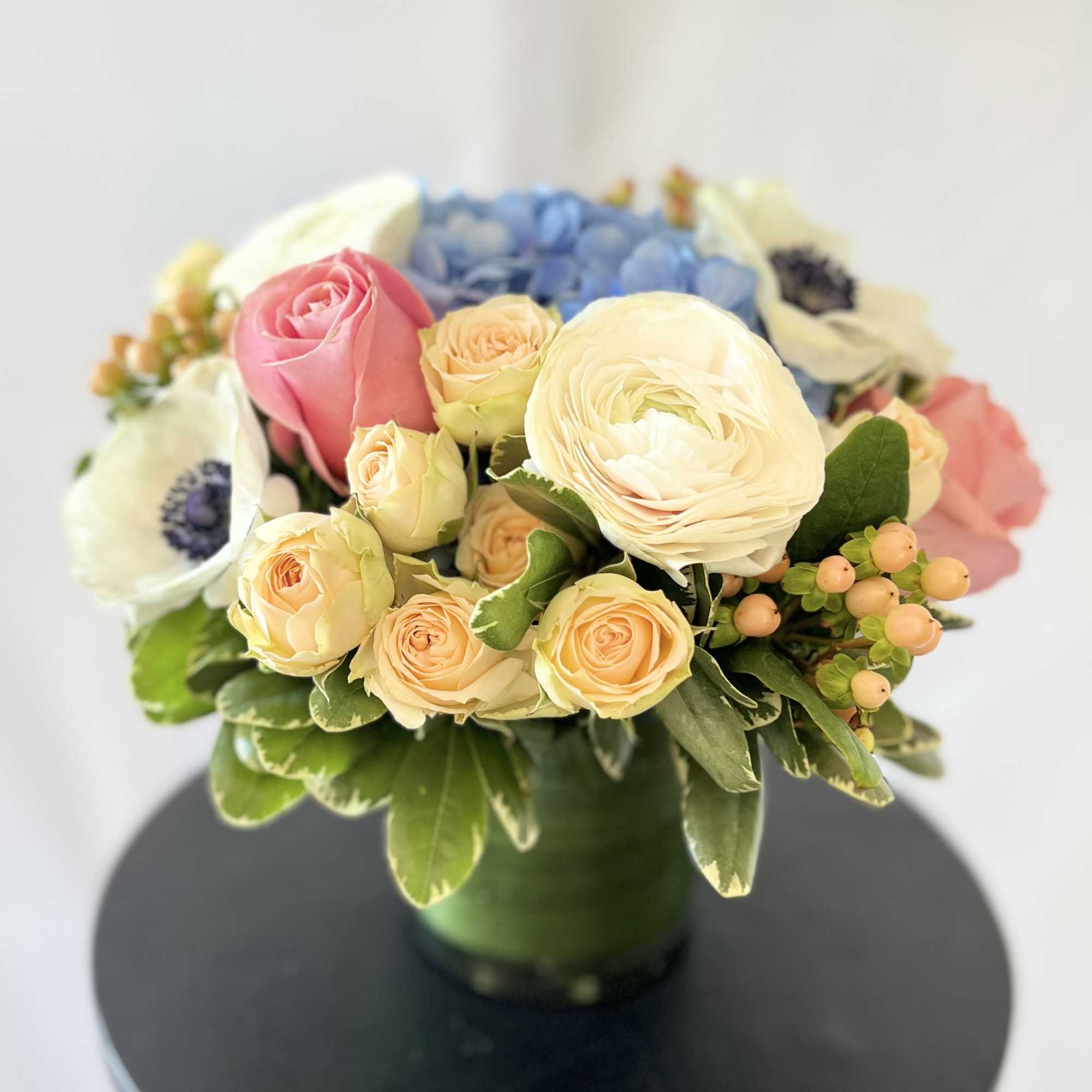 An exquisite and modern styled arrangement of our prettiest pastel blooms from
