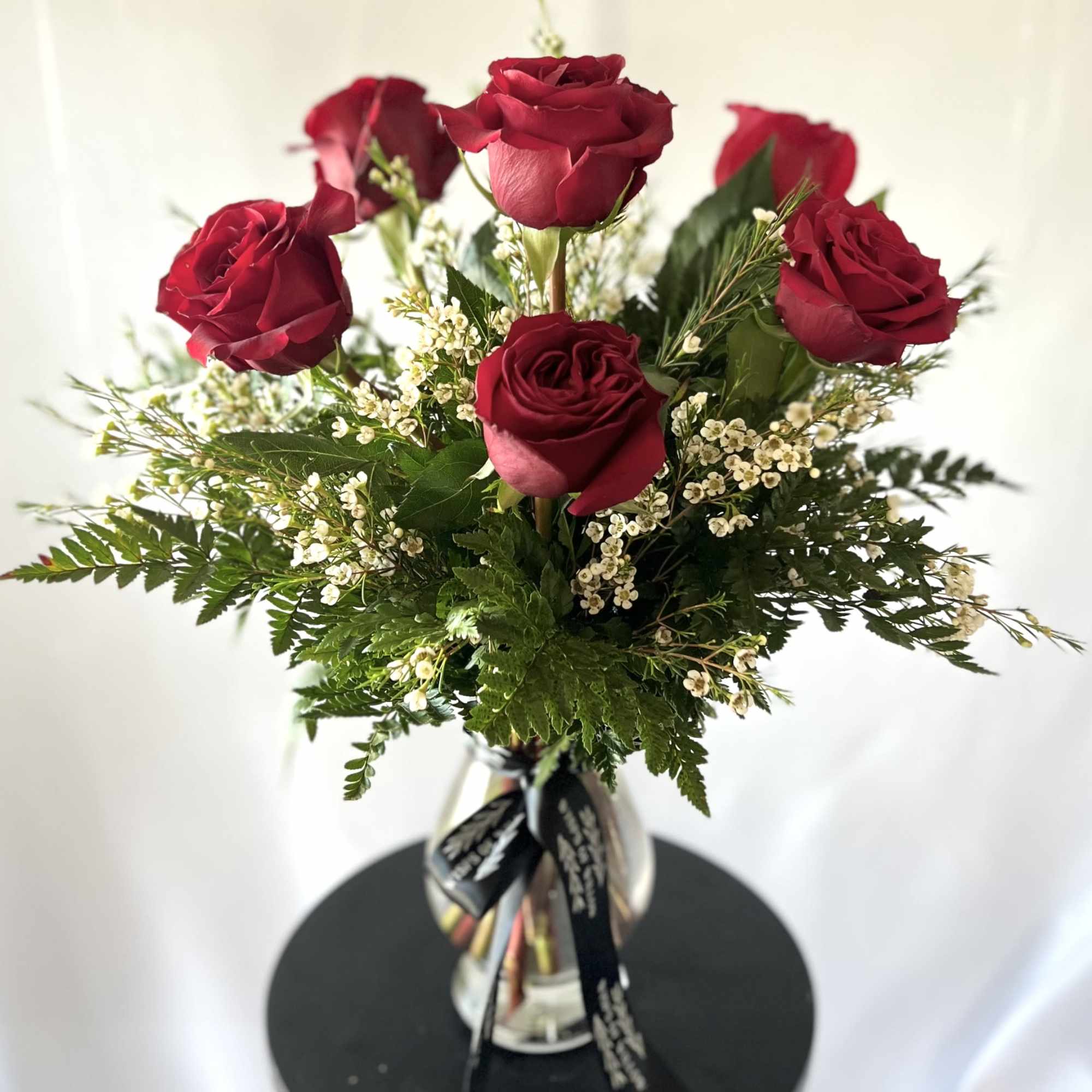 Each arrangement is delivered with a handwritten card.