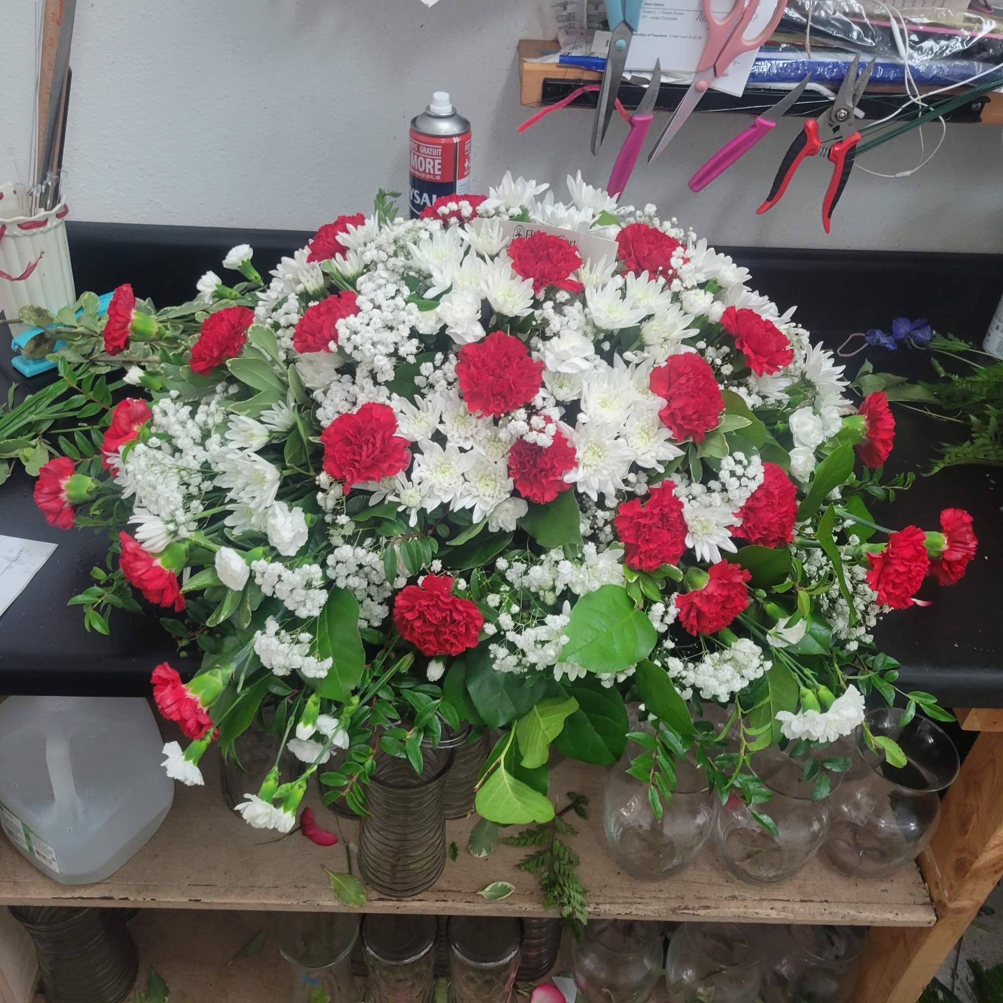 We make all casket sprays standard to cover half the casket if