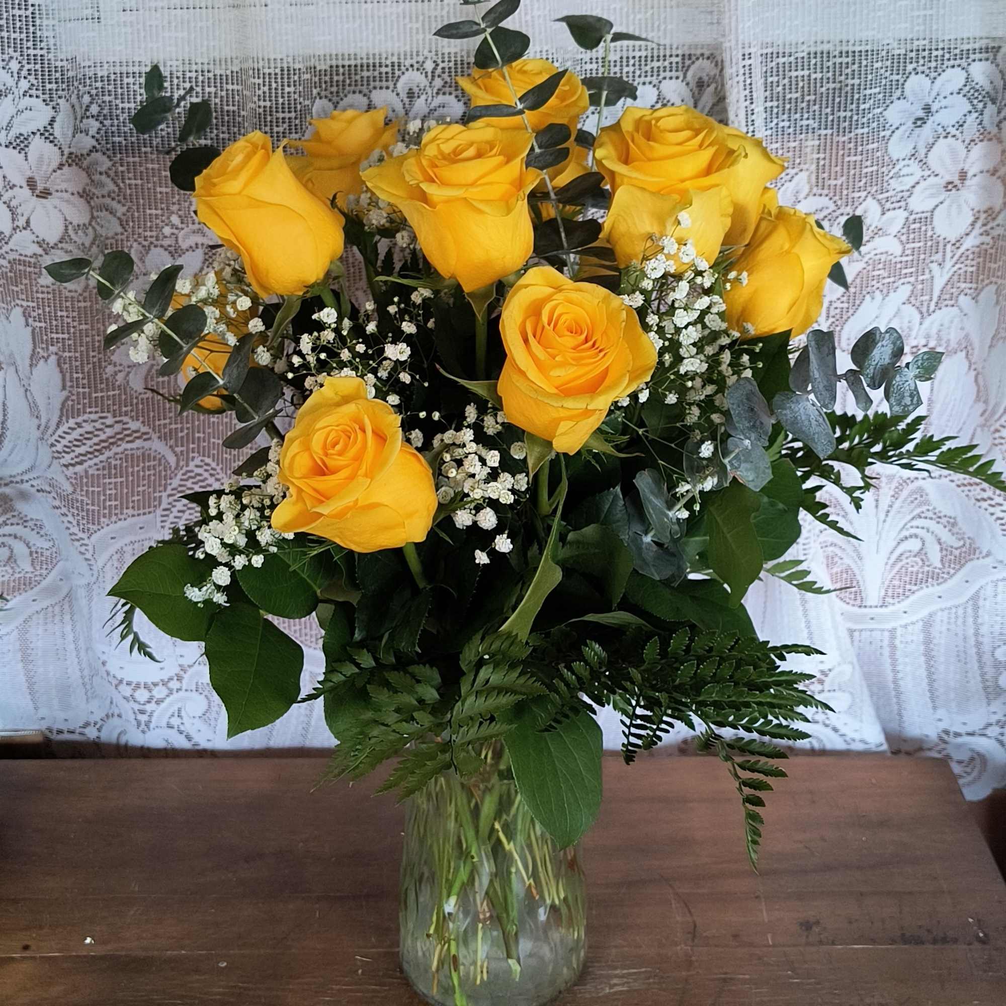 Sunshine yellow roses are sure to brighten any ones day. These sunny