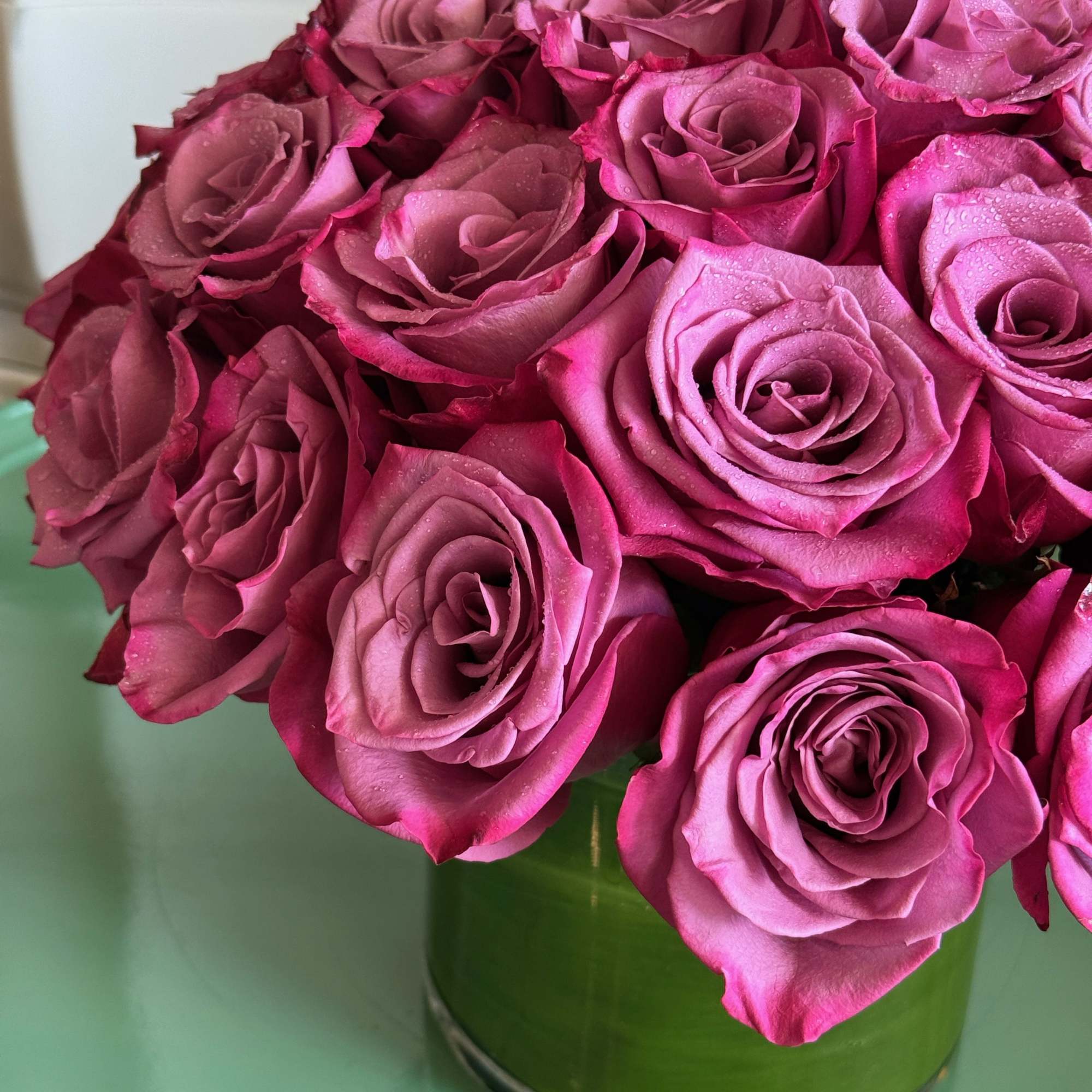 This beautiful bouquet of 24 lavender roses is sure to brighten anyone&rsquo;s