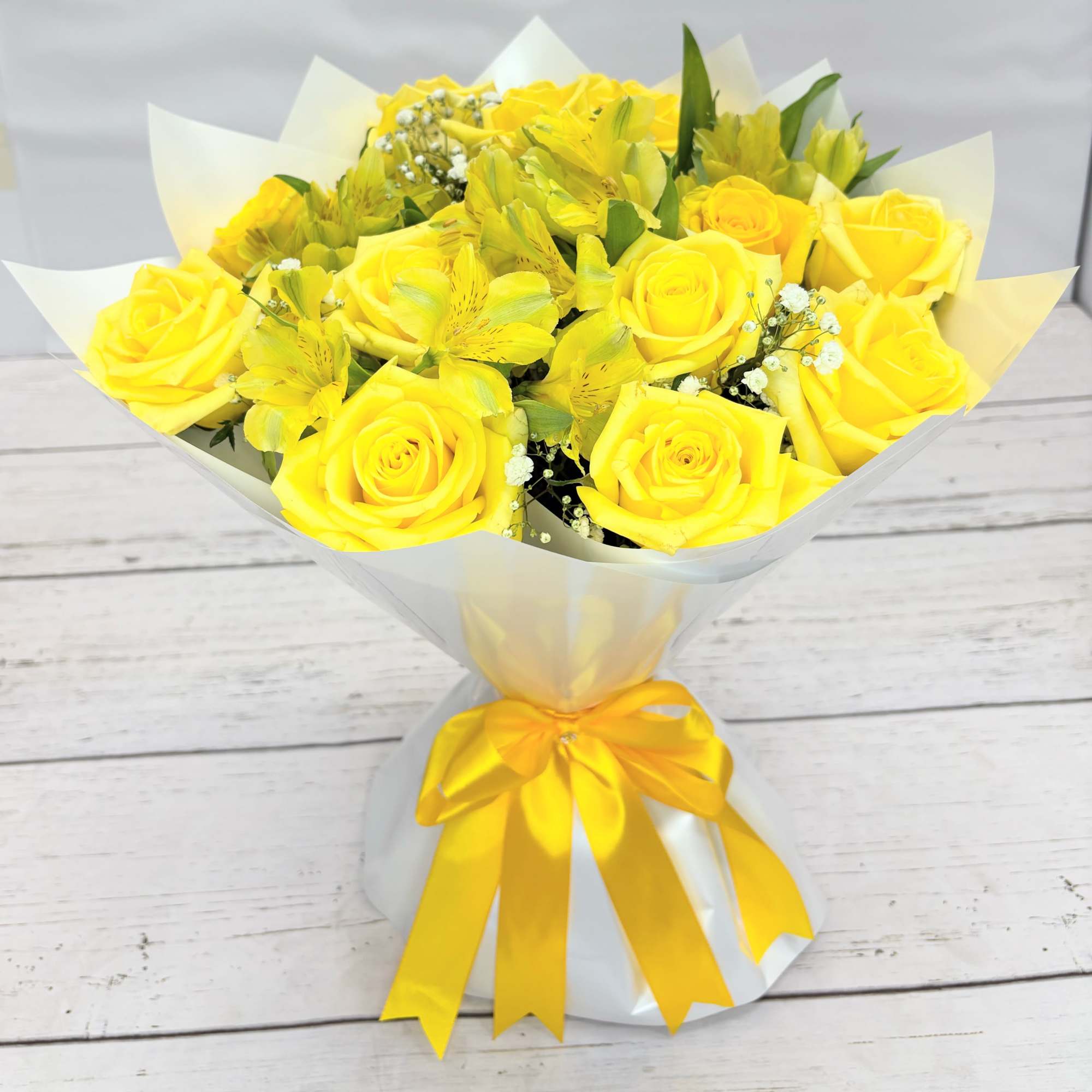 Yellow roses &amp; Alstroemeria-Wrap White paper and clear base.