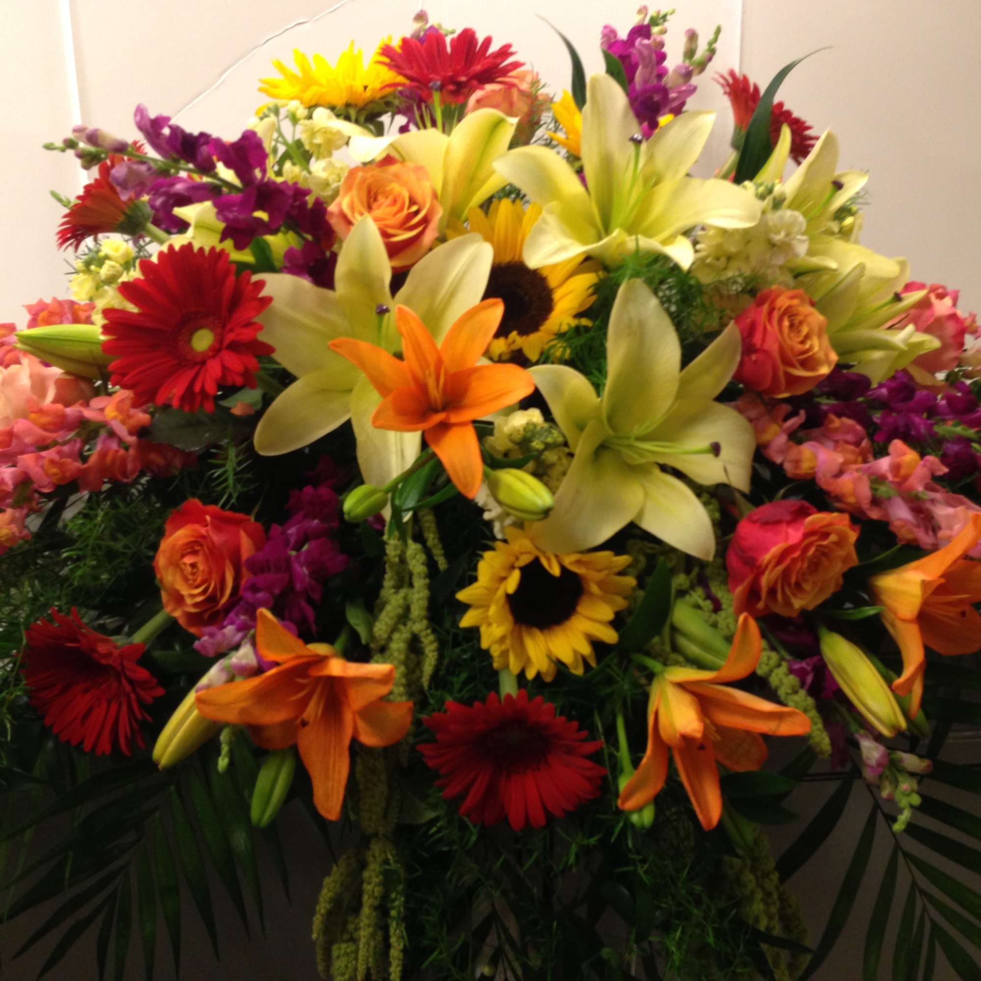 Sunflowers , Roses , Lilies , Snapdragons , Gerbera Daisies are elegantly