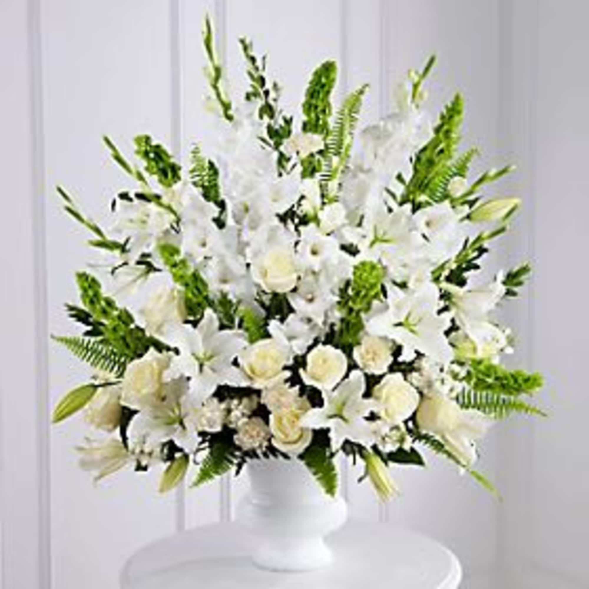 BRILLANT EXPRESSION OF PEACE AND SOFT SERENITY.
WHITE ROSES, STOCK, CARNATOINS GLADIOLUS AND