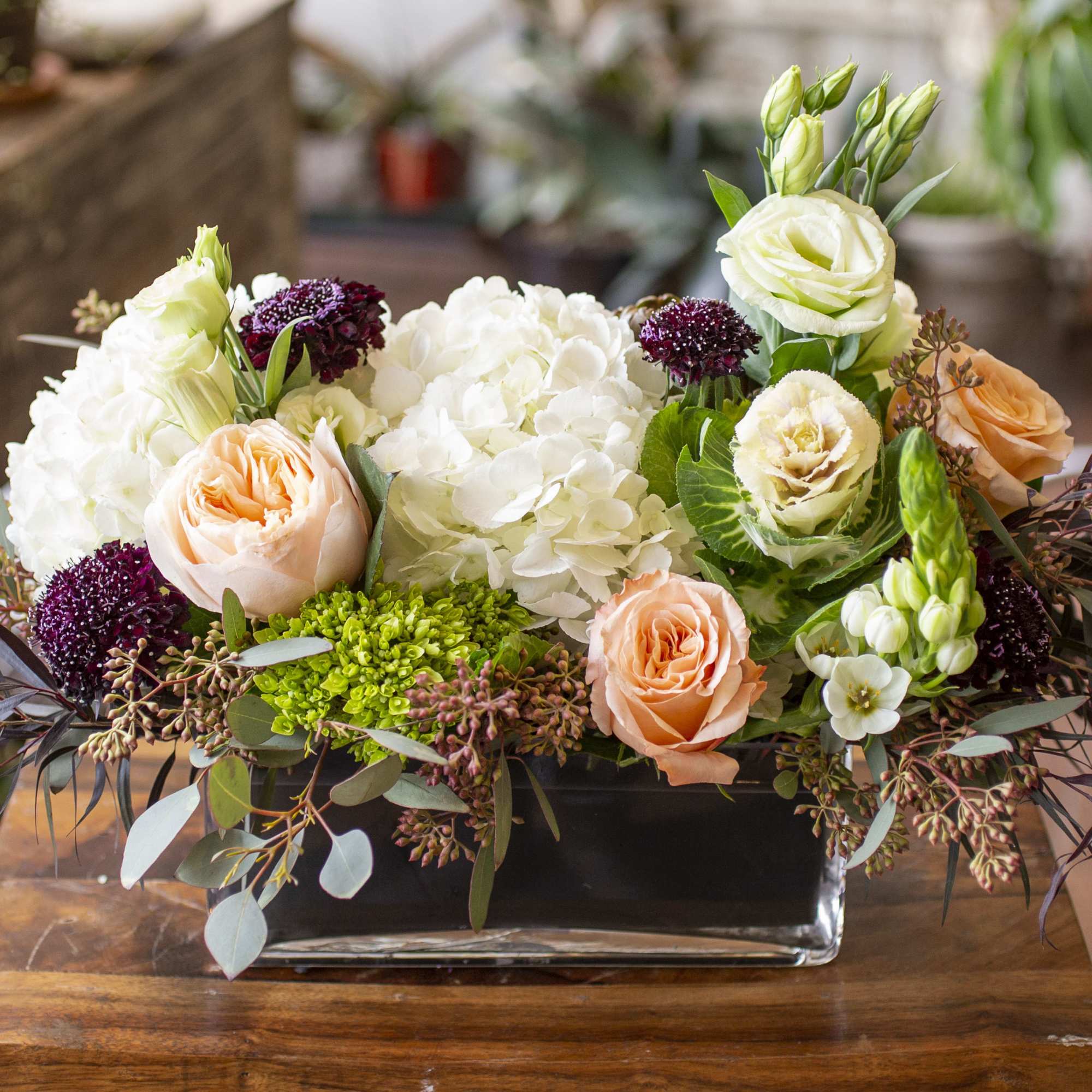Warm, cozy blooms in a glass vase.