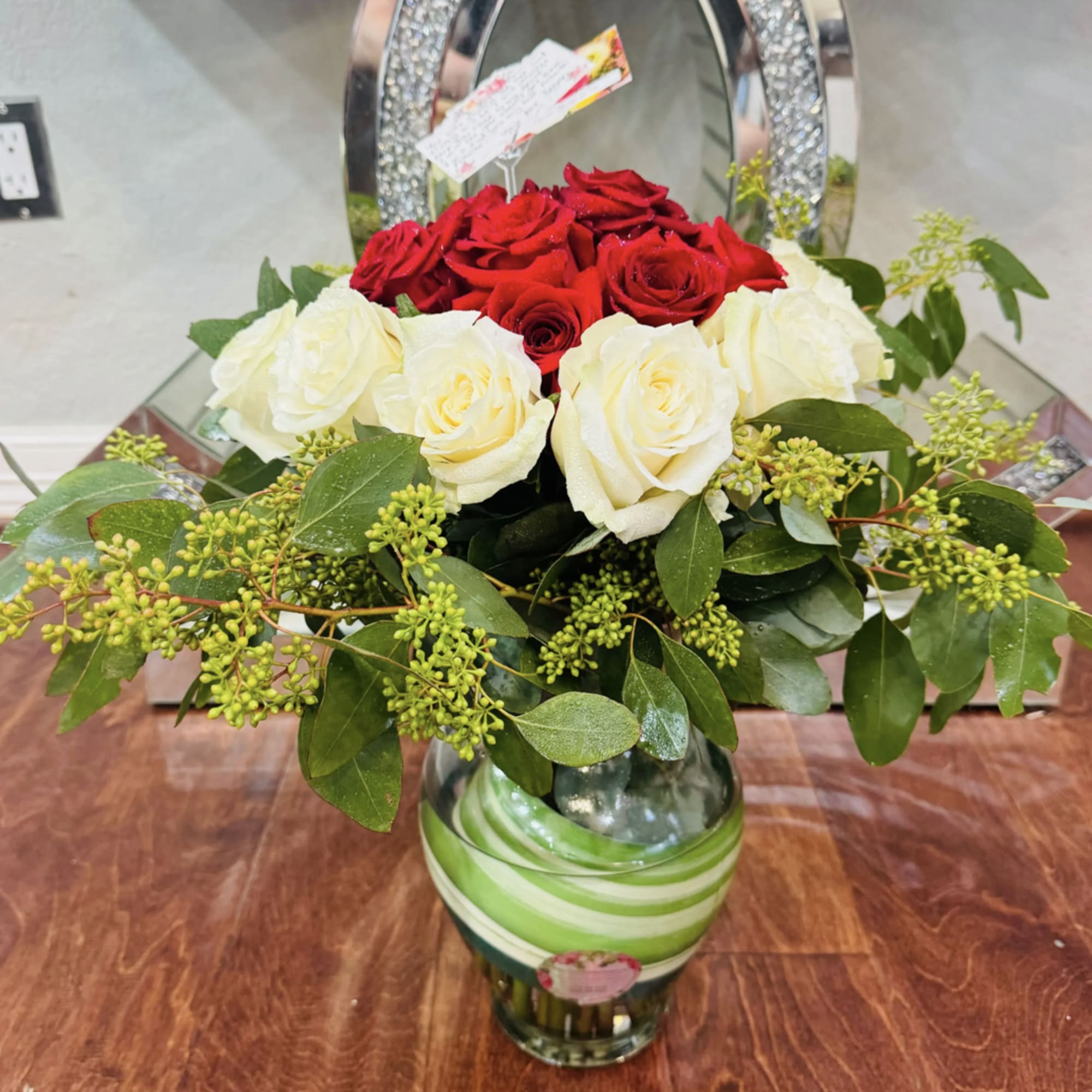 2 Dozen- Standard Bouquet
3 Dozen- Deluxe Bouquet
This white and red roses is