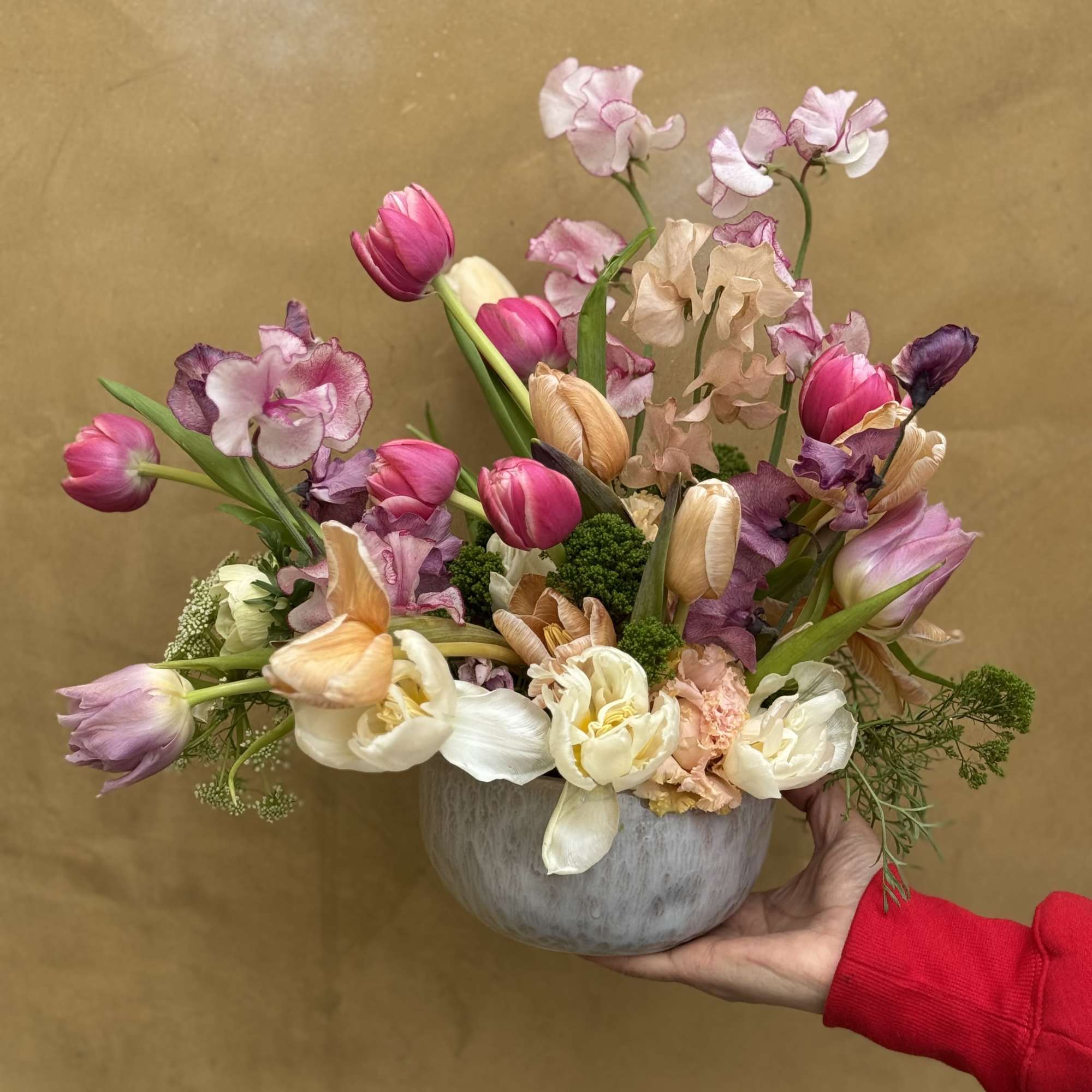 Dainty arrangement comprised of the most majestic blooms, emphasizing tuips and sweet
