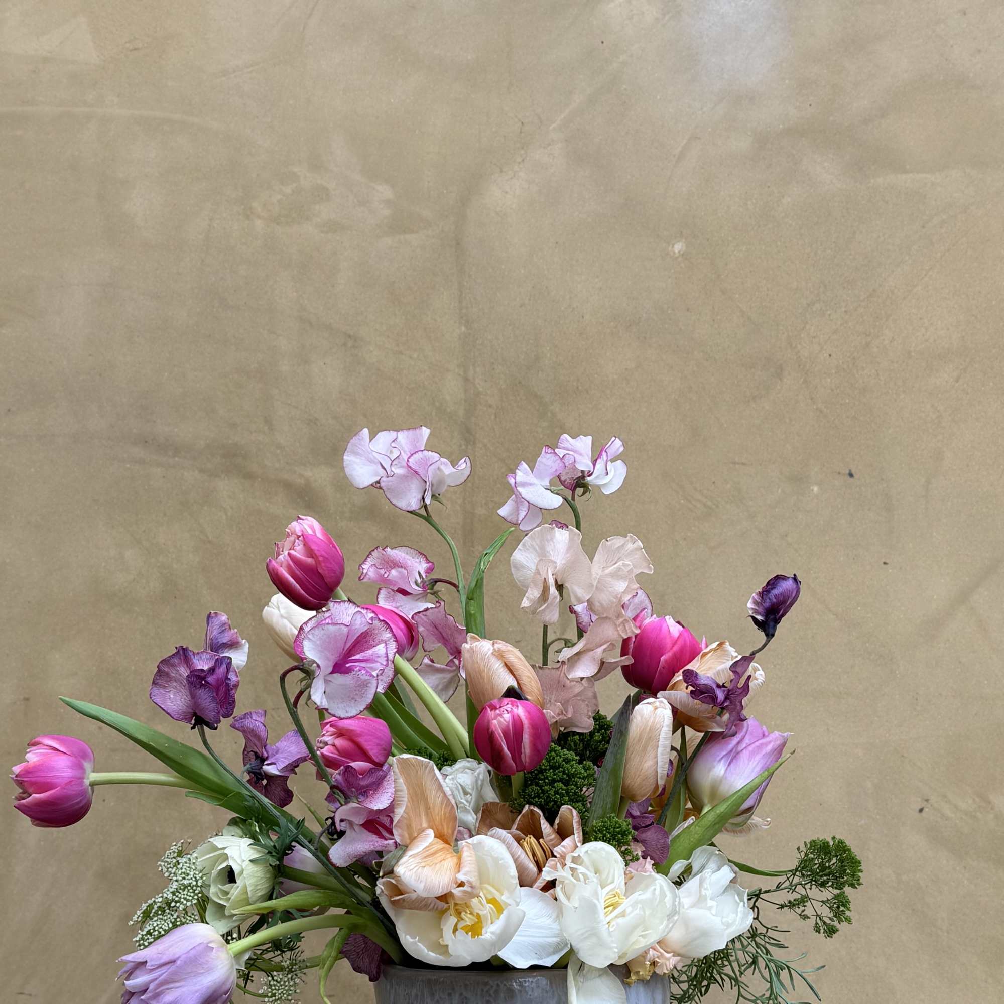 Dainty arrangement comprised of the most majestic blooms, emphasizing tuips and sweet