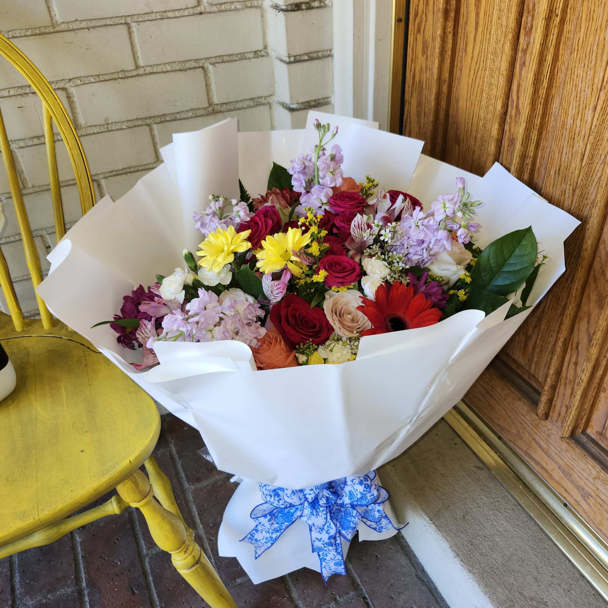 Designer's Choice Wrap Bouquet in vibrant colors in season florals. Ready to