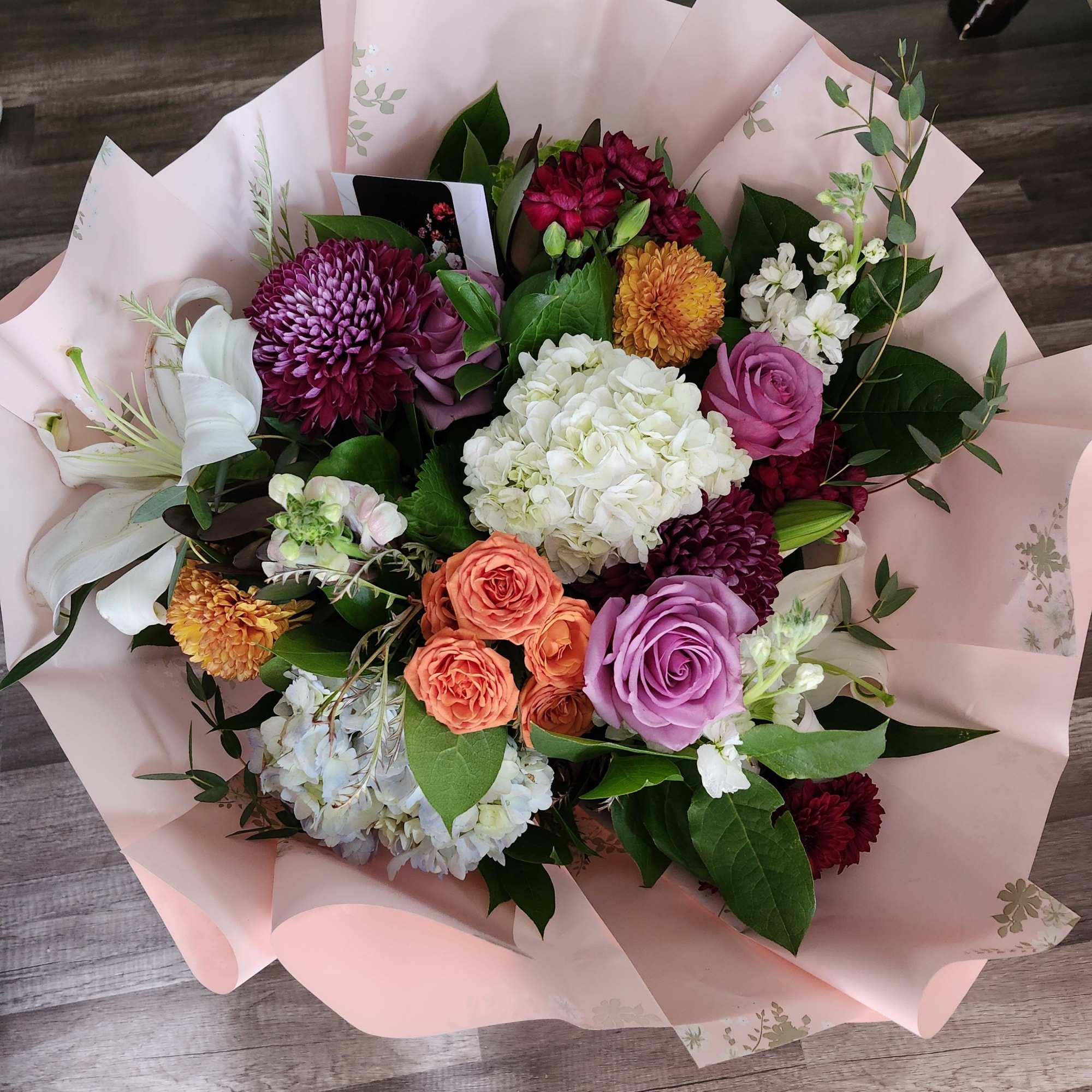 Designer's Choice Wrap Bouquet in vibrant colors in season florals. Ready to