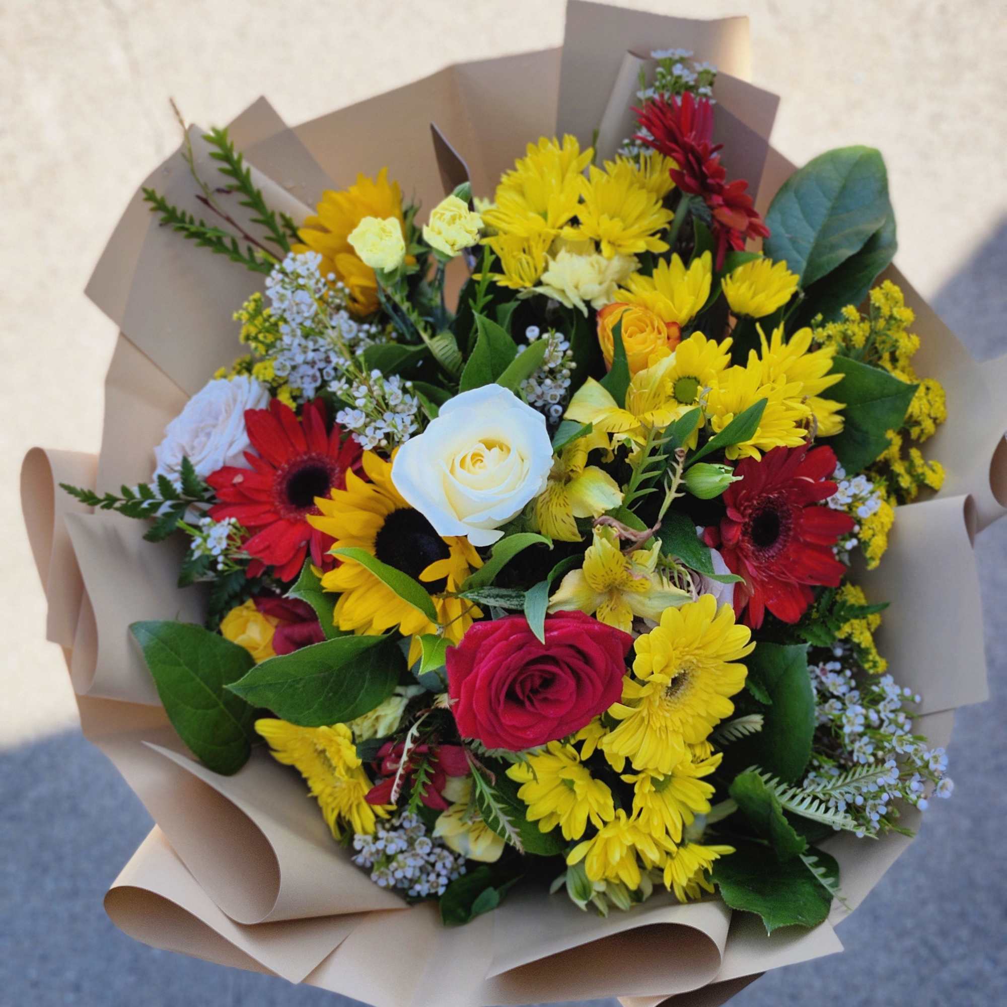 Designer's Choice Wrap Bouquet in vibrant colors in season florals. Ready to