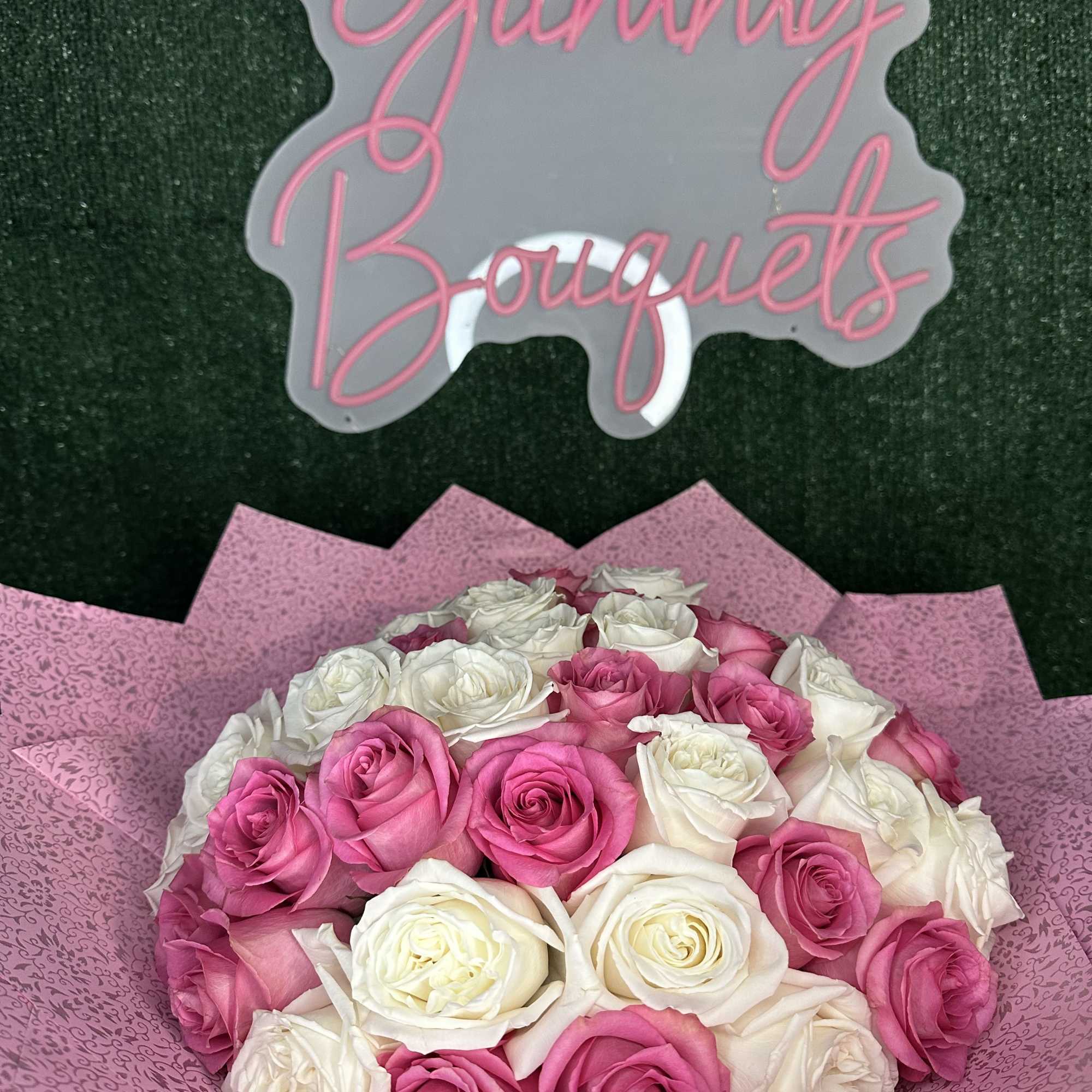 Standard 35 roses
Deluxe 50 roses (picture)
Does not include a vase
Banner are additional