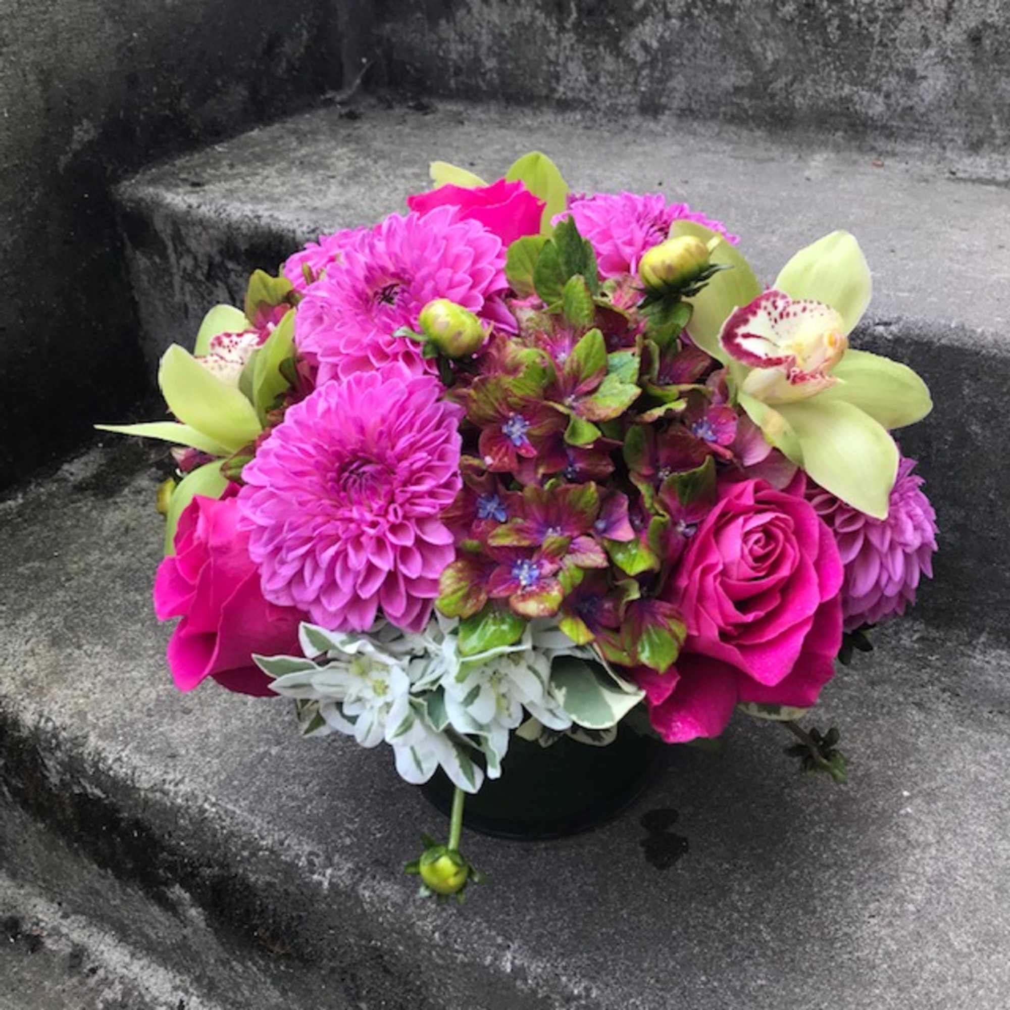 A medium-size floral arrangement that will not overwhelm a desk or coffee