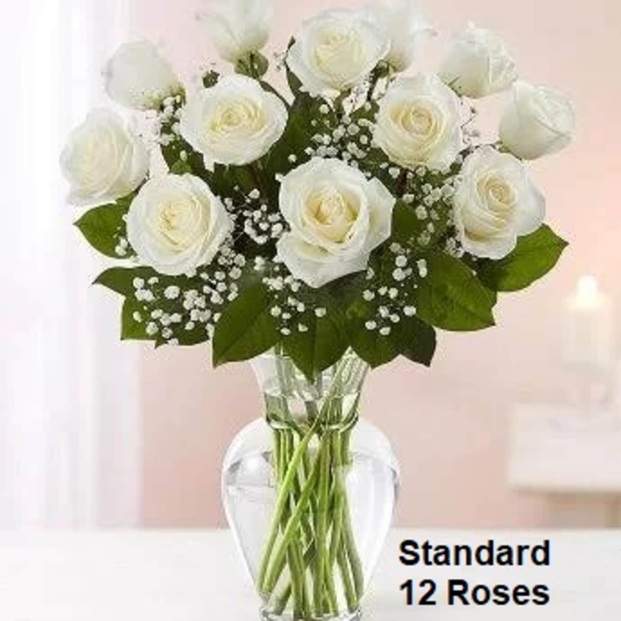 Standard: 12 White Roses arranged in a vase.
Deluxe: 18 White Roses and