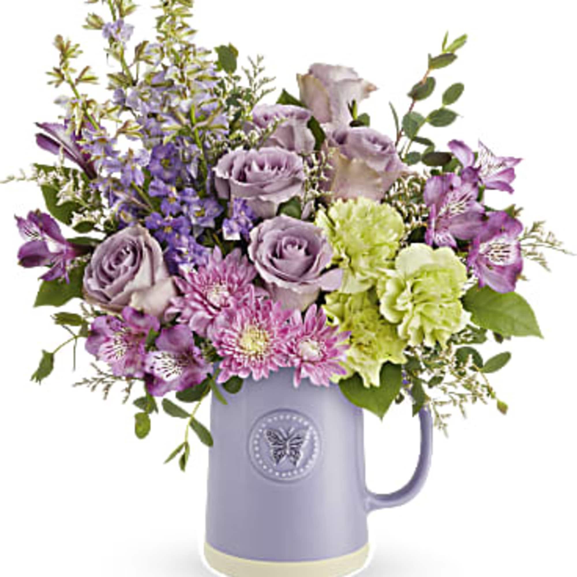 Indulge Mom's love for artisanal charm with our glazed ceramic pitcher, featuring