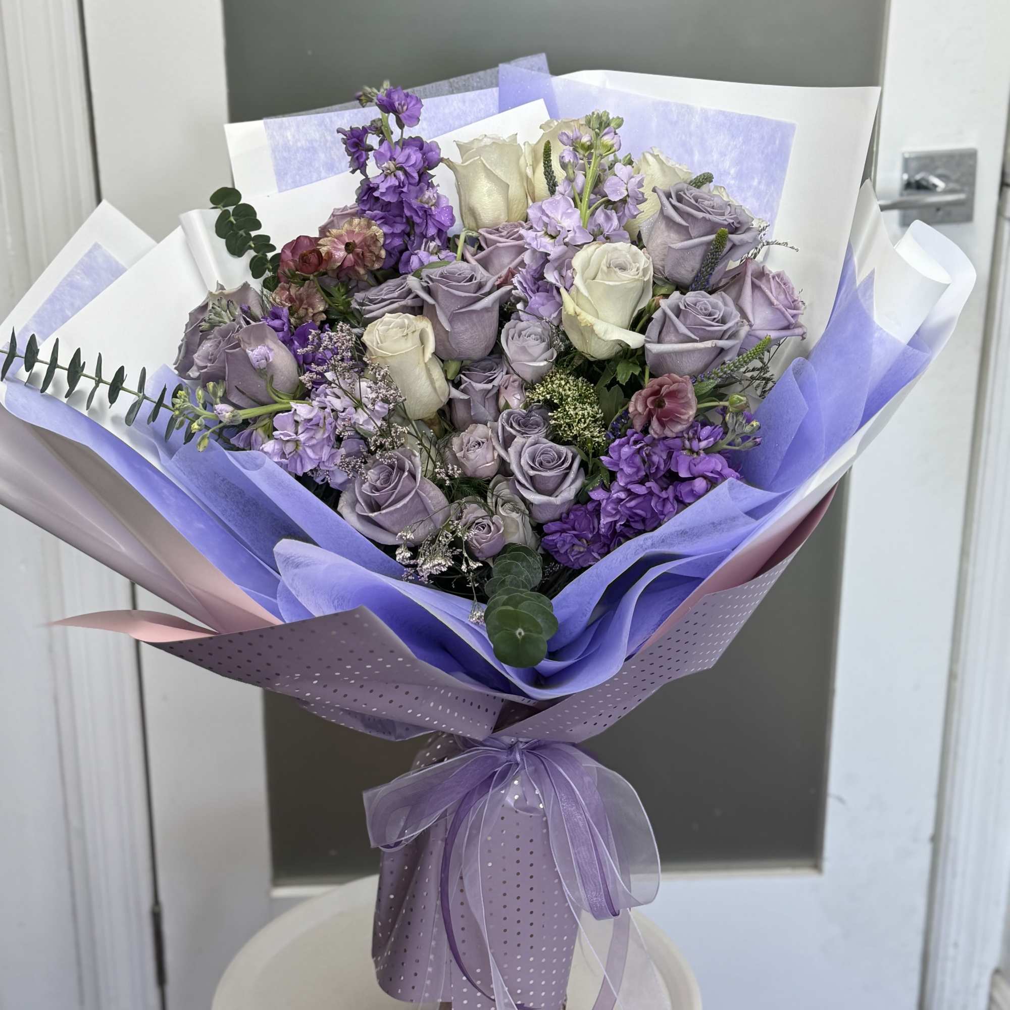 A full boom of purple flowers wrap it in a bright way