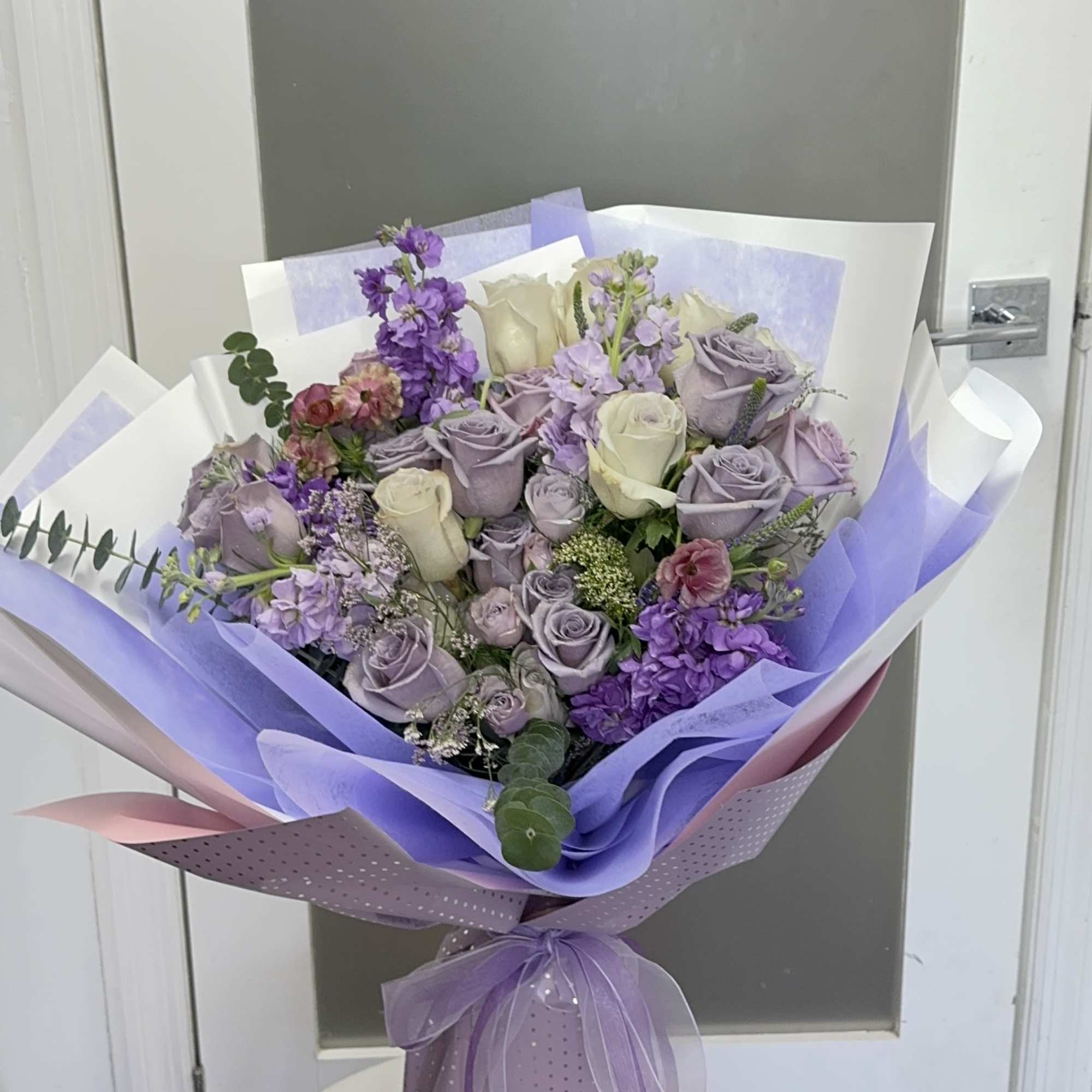 A full boom of purple flowers wrap it in a bright way