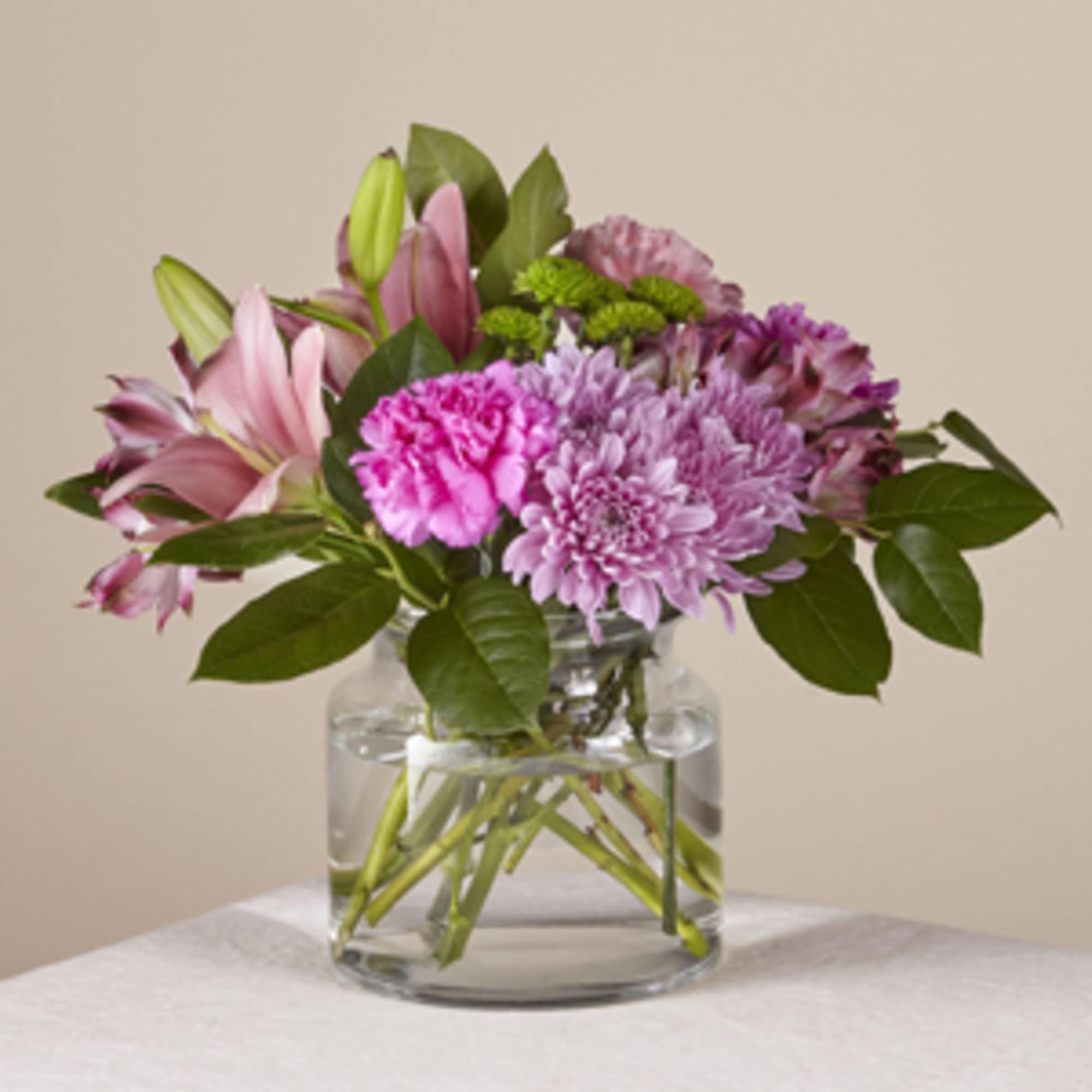 A pretty pink and lavender display of blooms are arranged in a