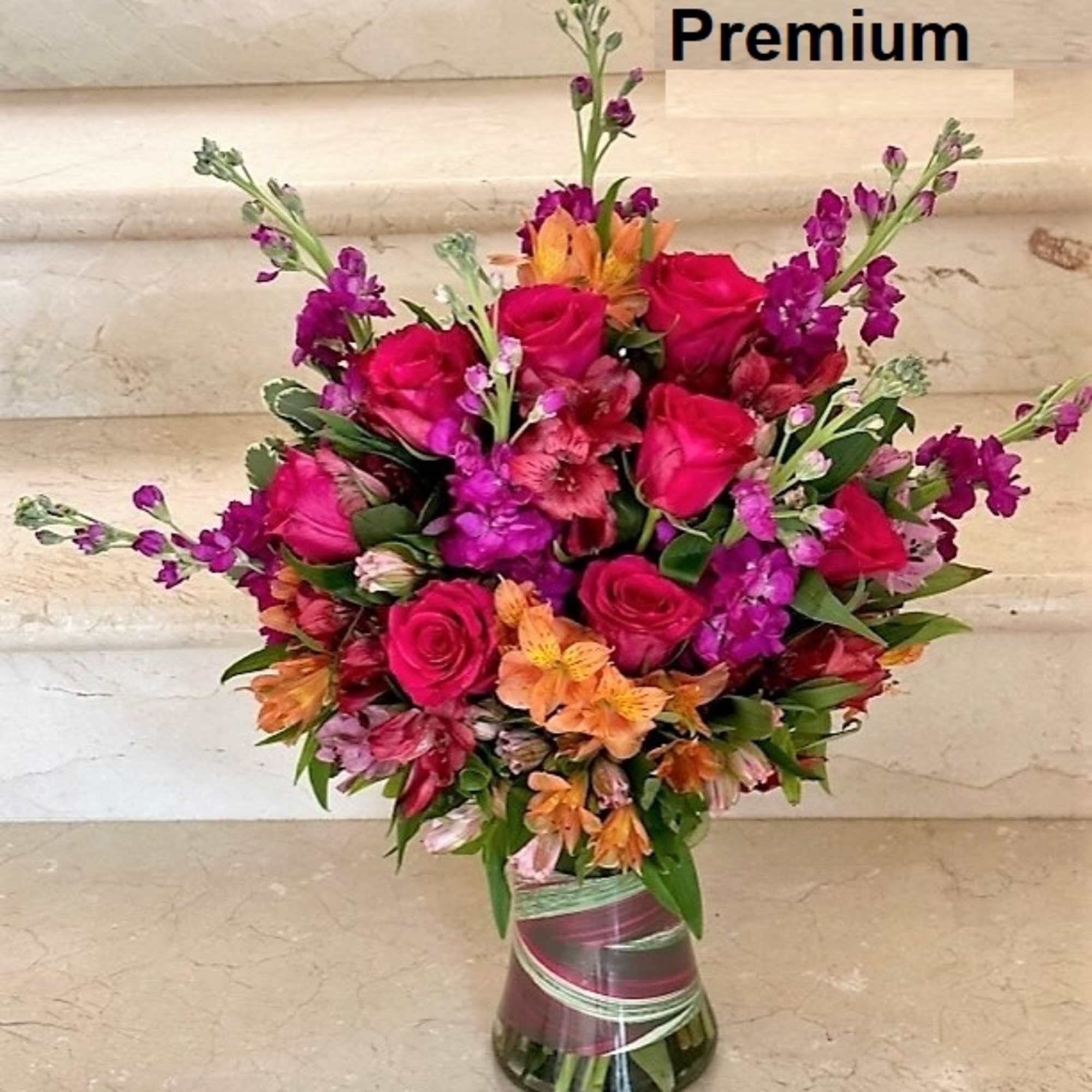 Mix of flowers arranged in a vase.
