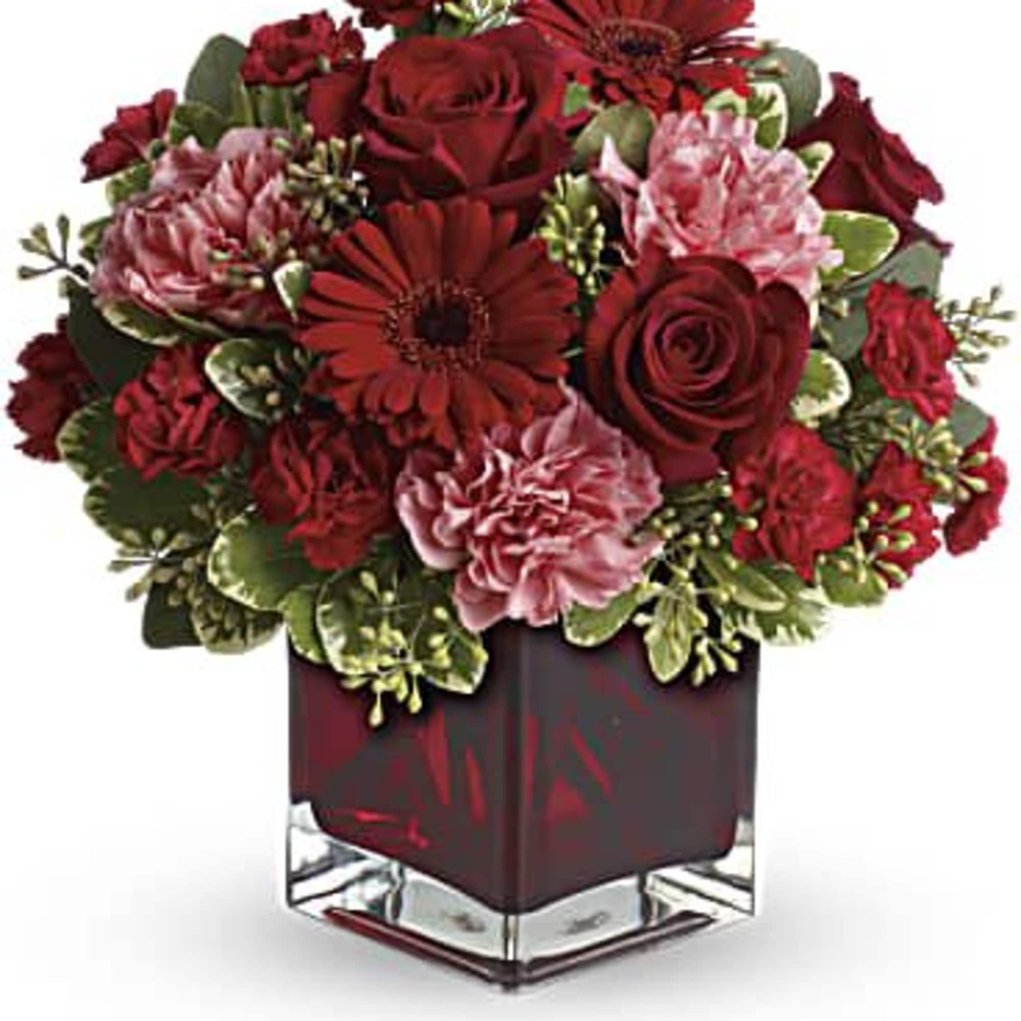 Perfect for your valentine. This arrangement is designed in a red cube