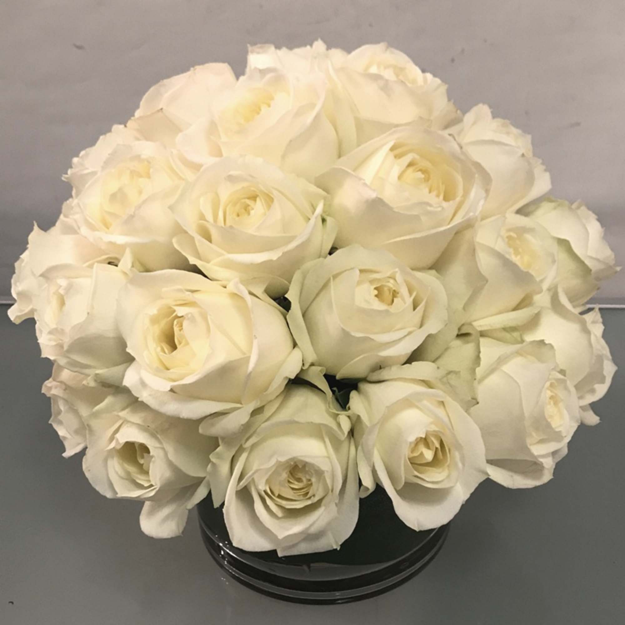 Make a bold statement with this elegantly simple design. White roses symbolize
