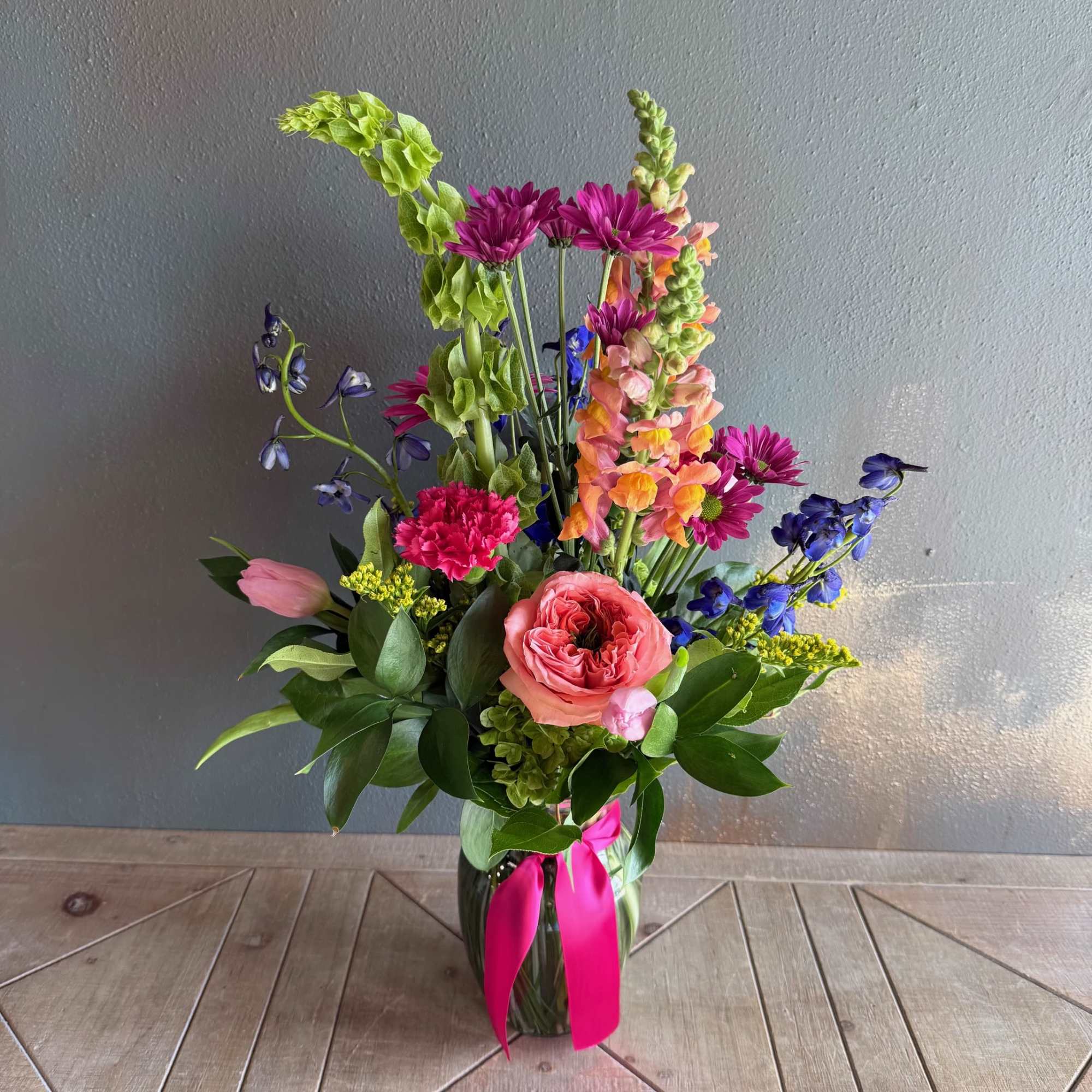Colorful and charismatic, this arrangement is sure to bring a smile to