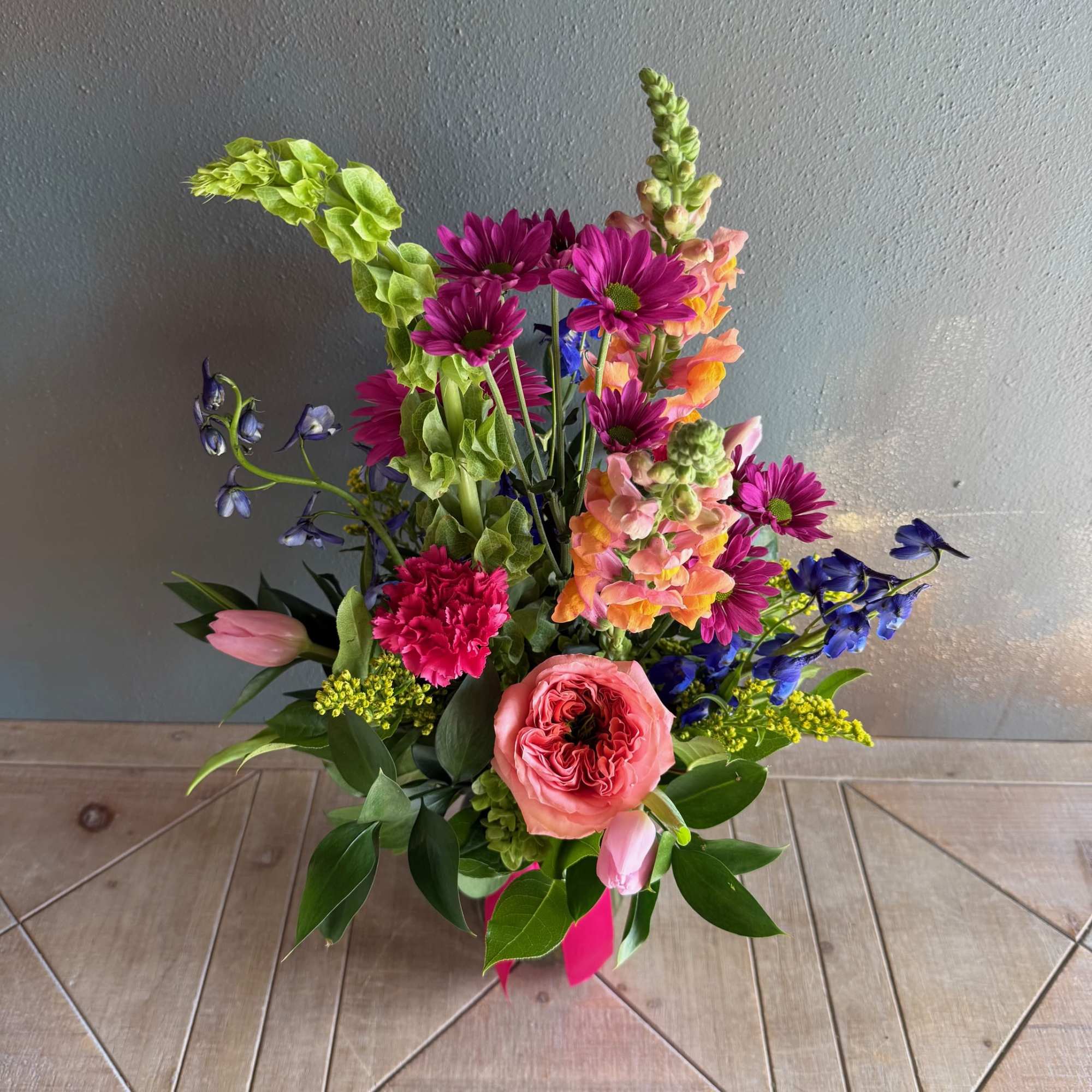 Colorful and charismatic, this arrangement is sure to bring a smile to