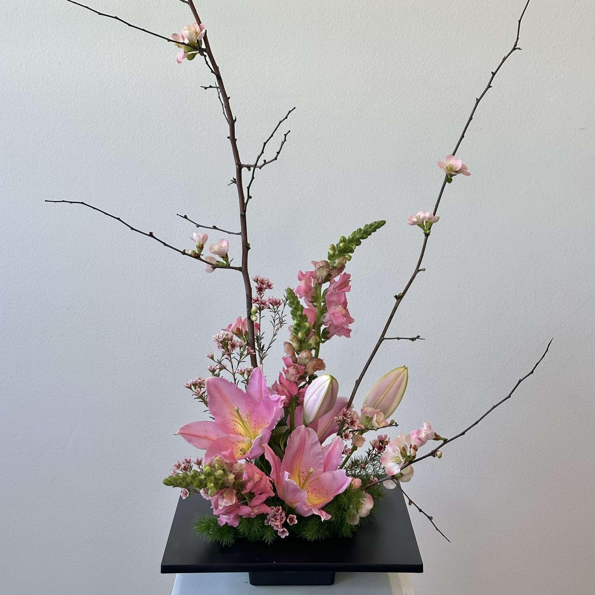 Discover the serene elegance of our Spring Blossom Ikebana-style arrangement, a harmonious